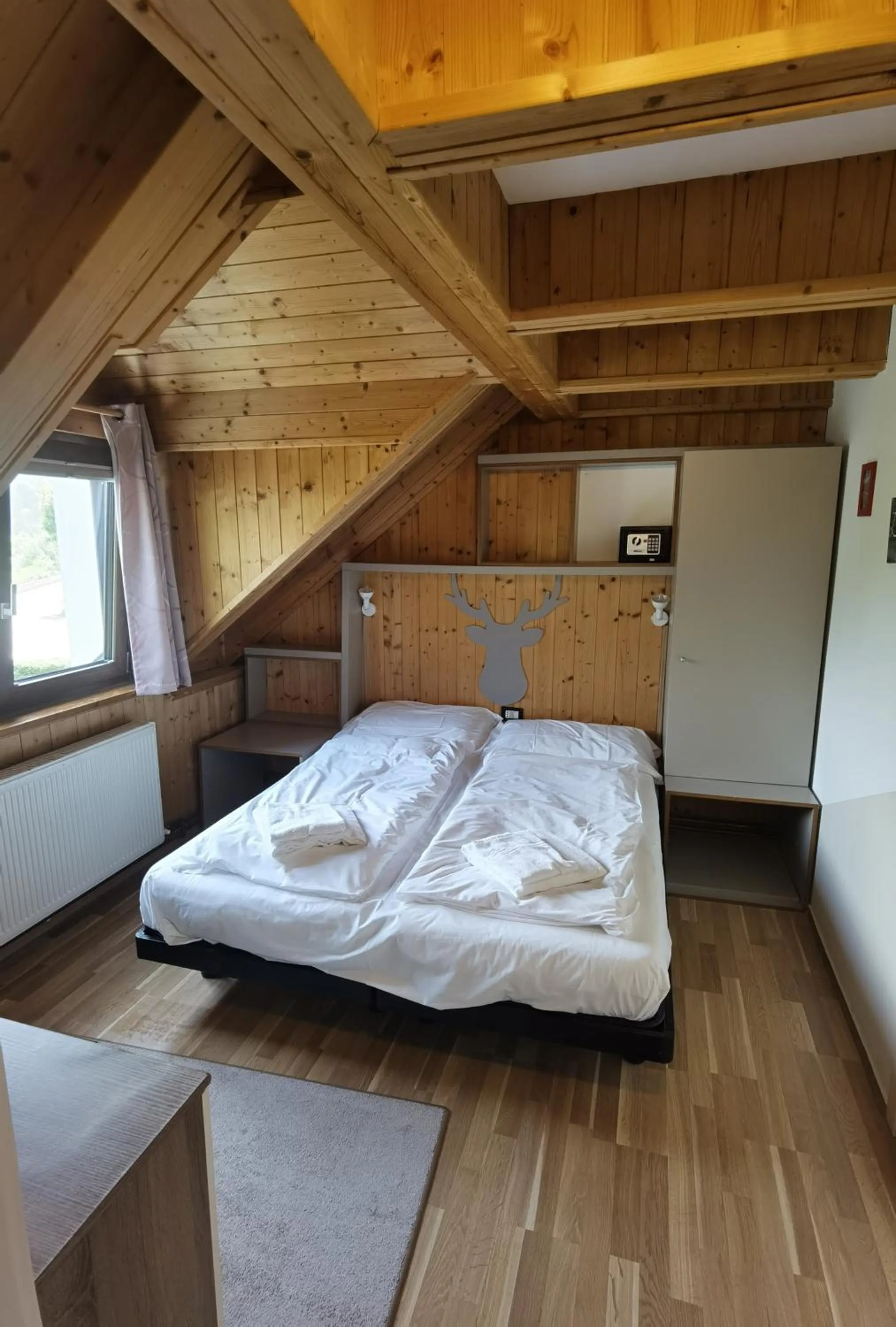 Bed in Hotel Tarvisio Four Seasons