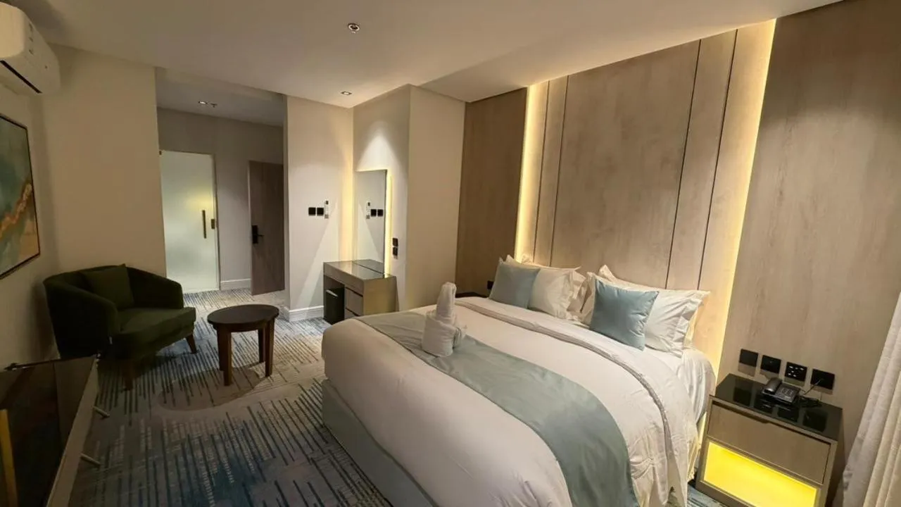 Bed in Rose Garden Hotel فندق روز جاردن