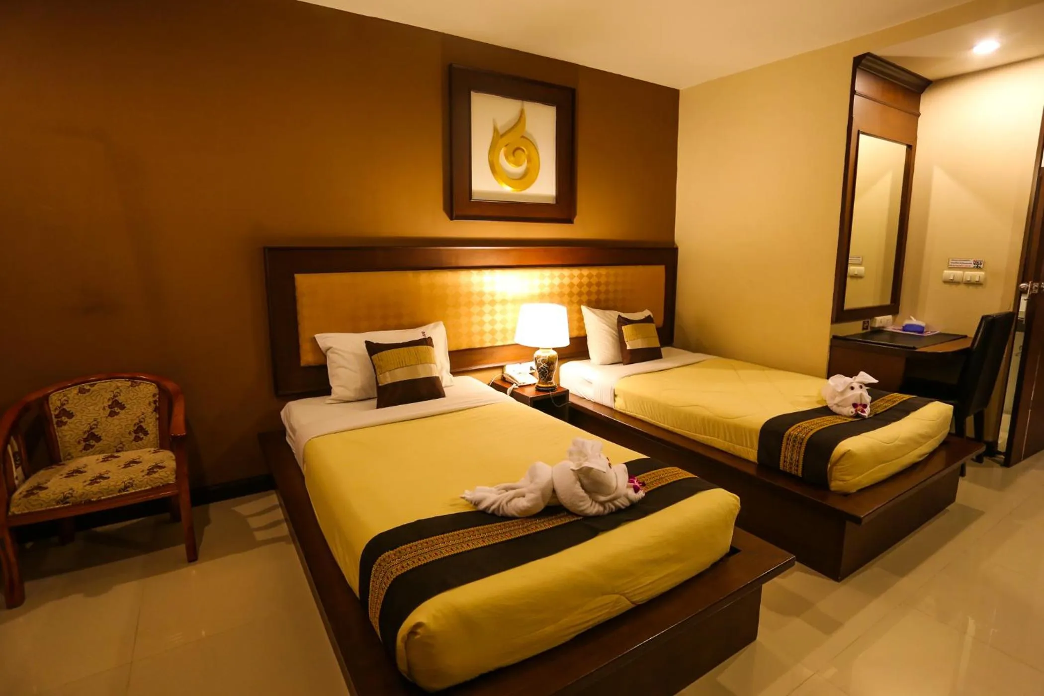 Bed in Madina Rayong Hotel