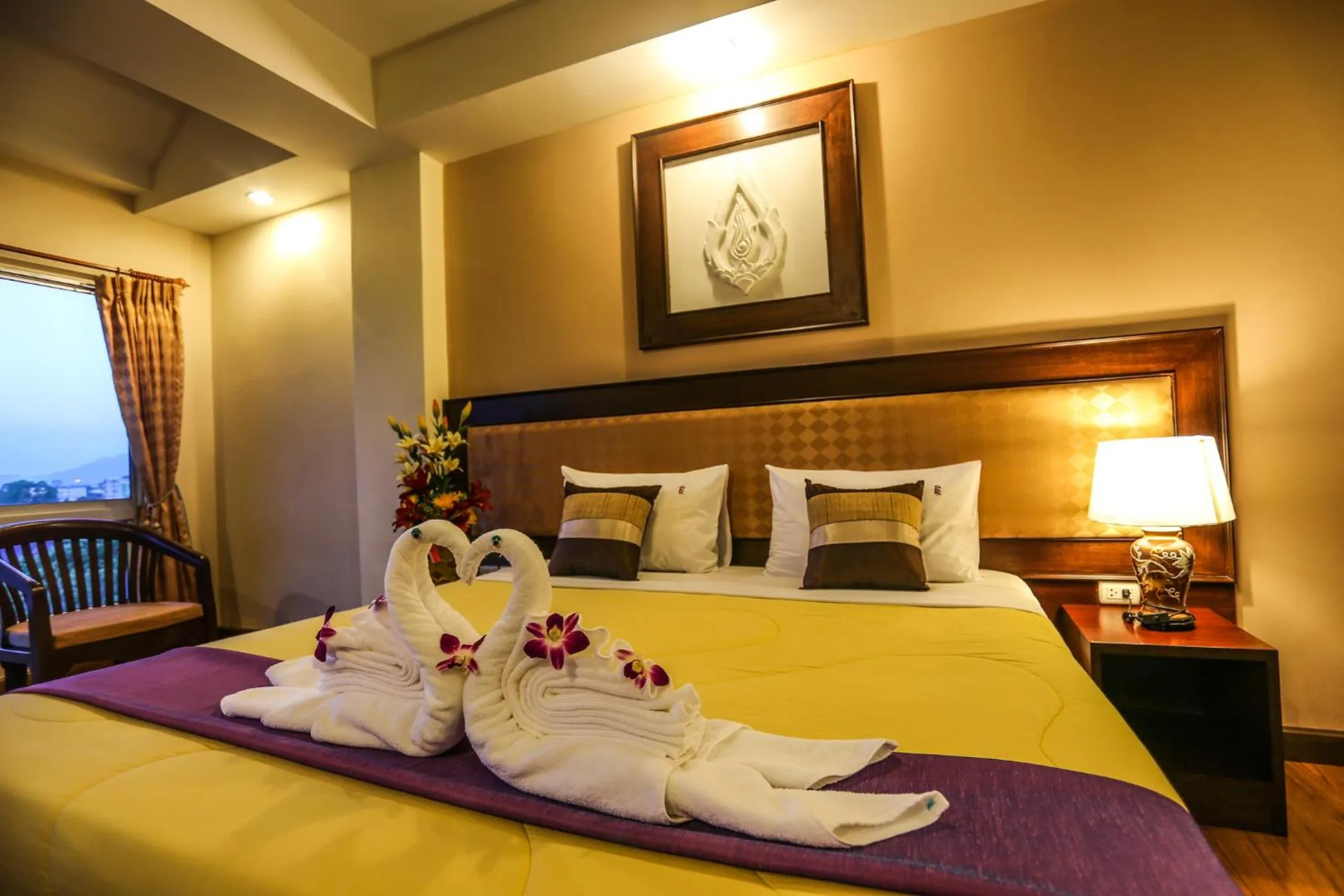 Bed in Madina Rayong Hotel