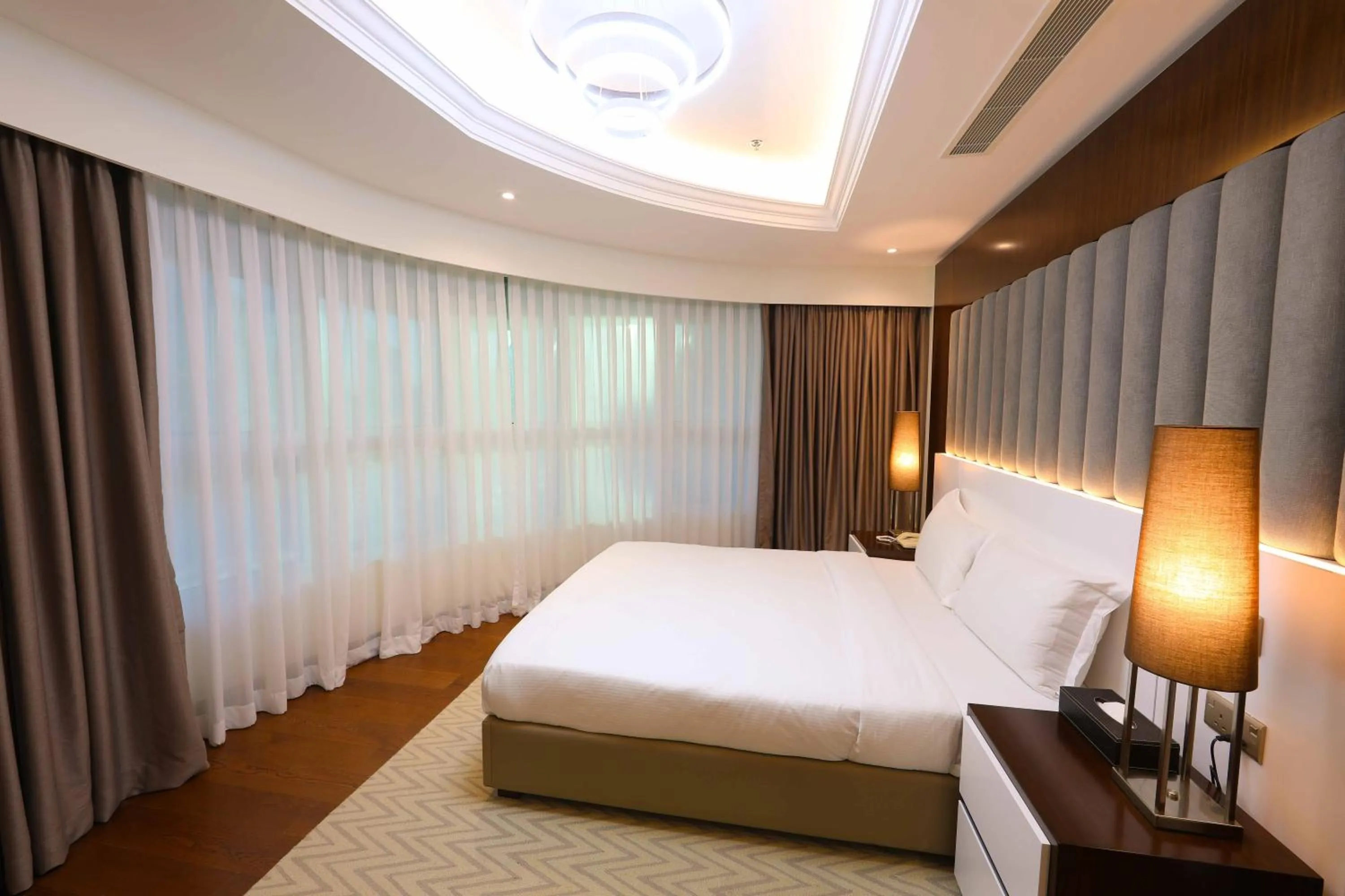 Bed in Number One Tower Suites