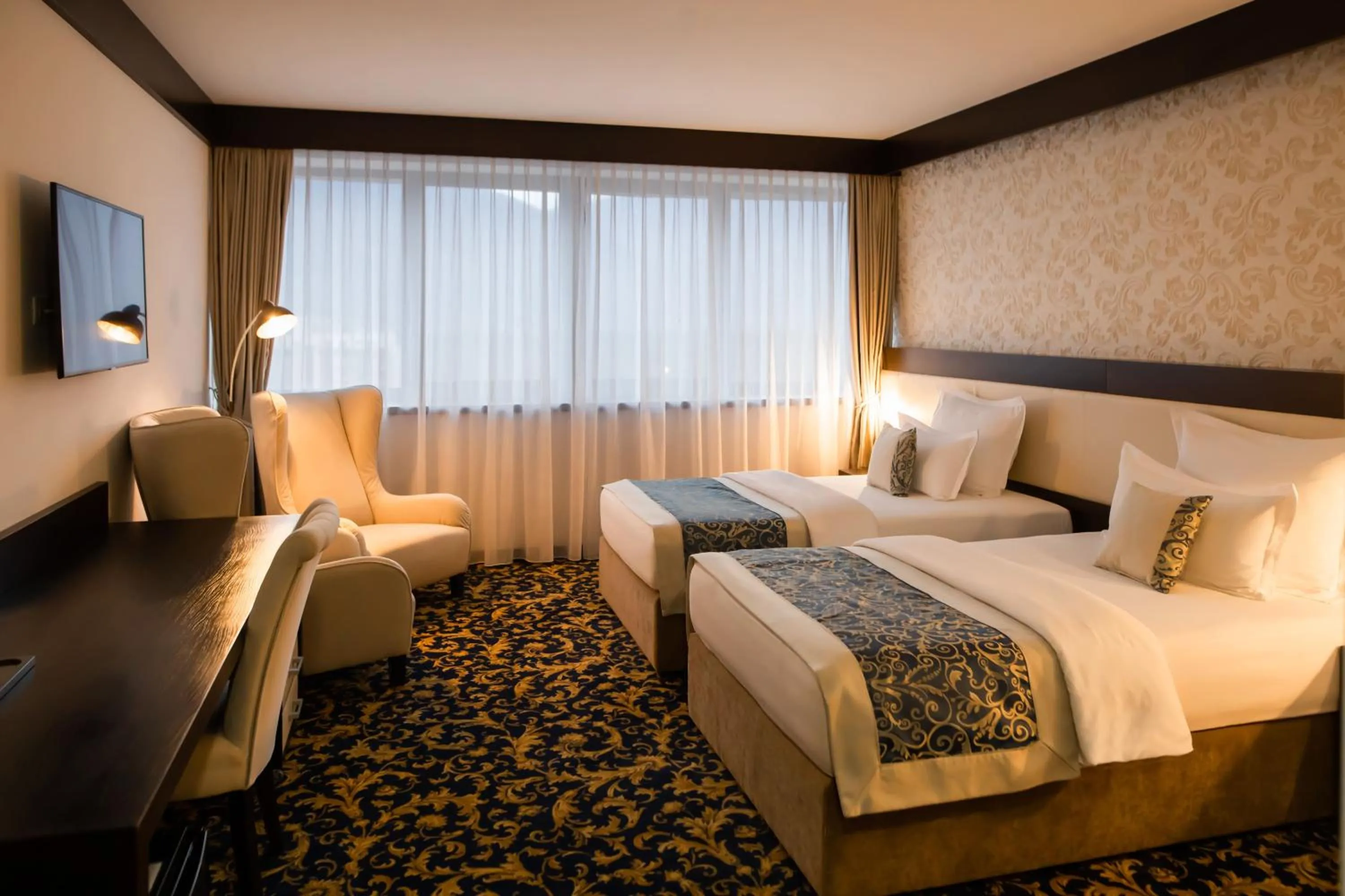 Bed in Malak Regency Hotel