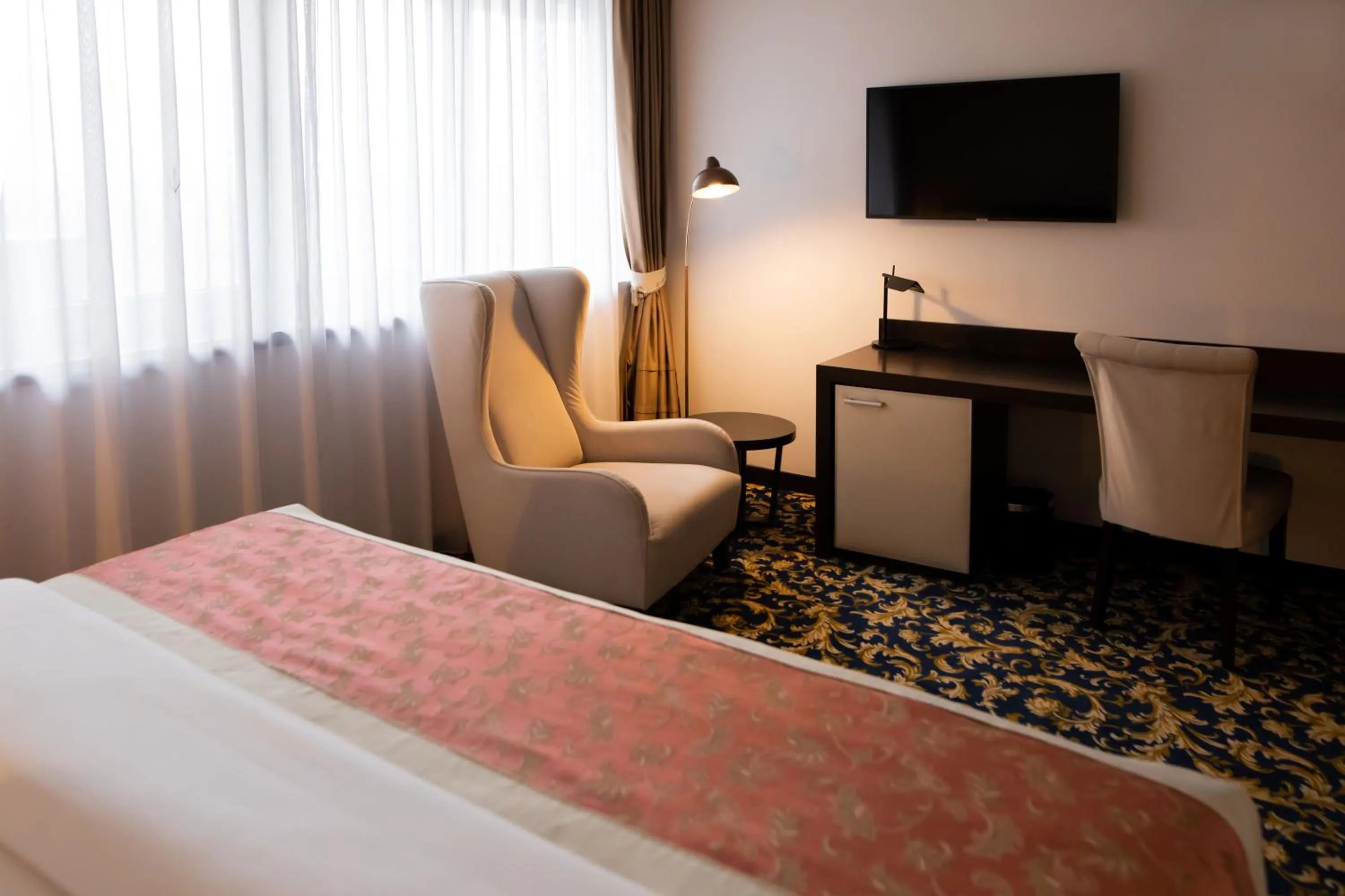 Bed in Malak Regency Hotel