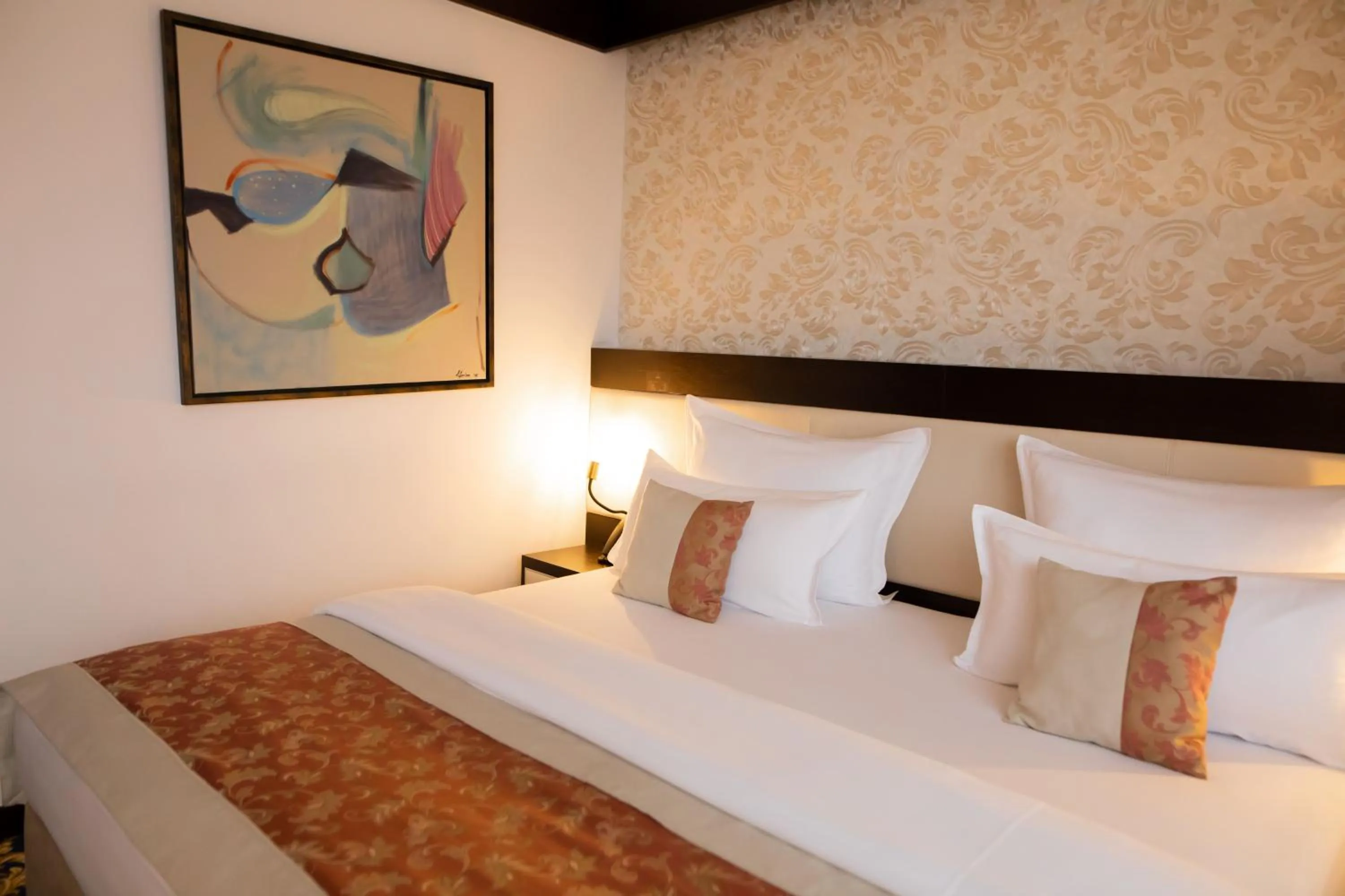 Bed in Malak Regency Hotel