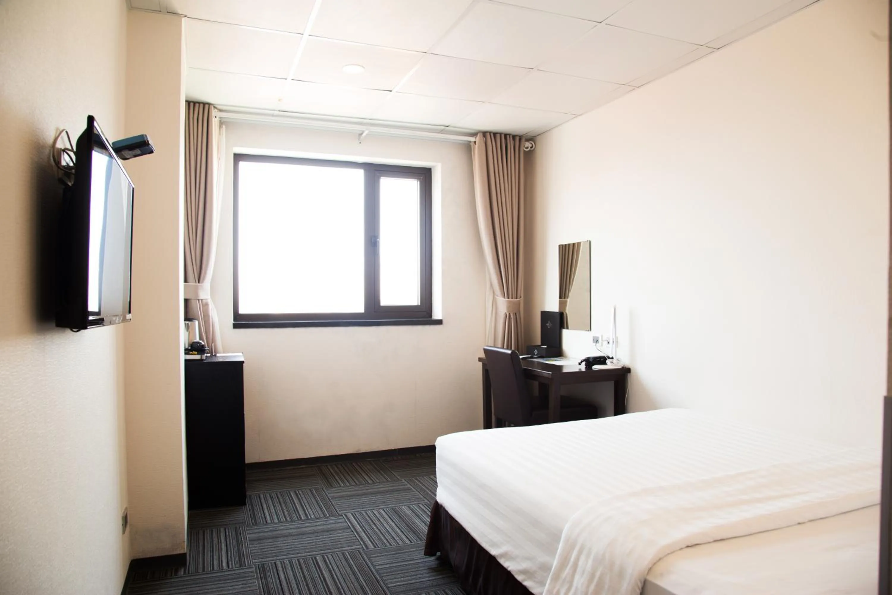 Bed in Sakura Hotel 3