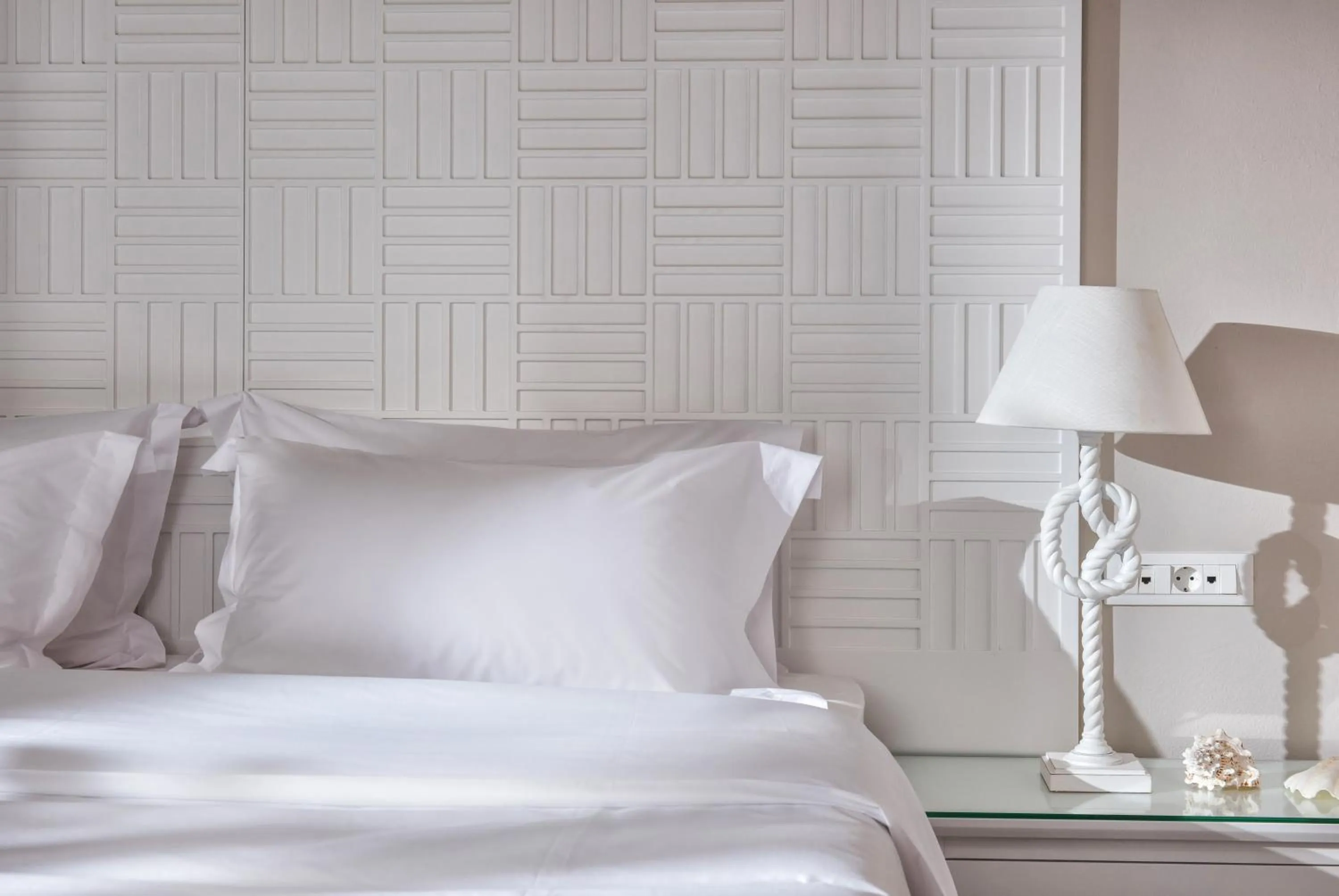 Bed in Notos Heights Hotel & Suites