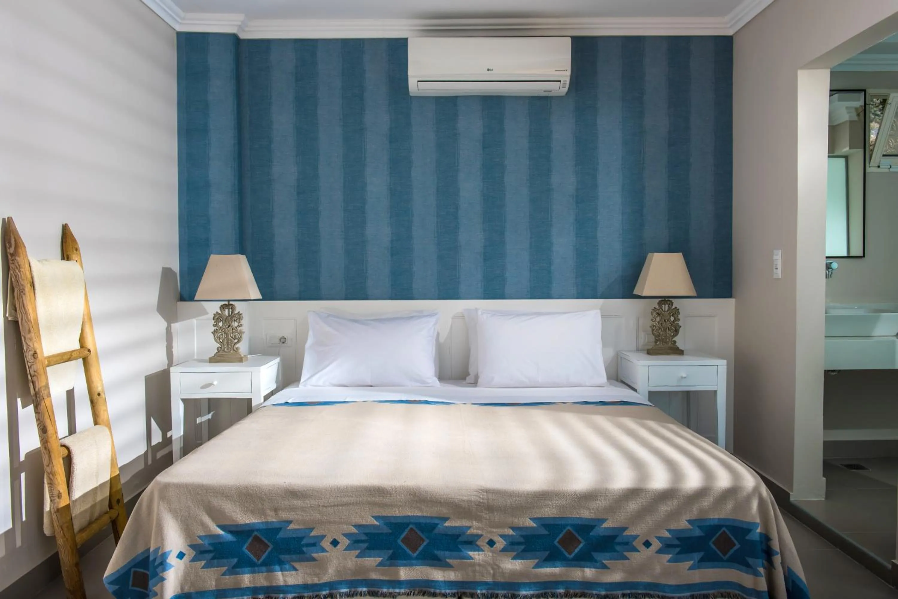 Bed in Notos Heights Hotel & Suites