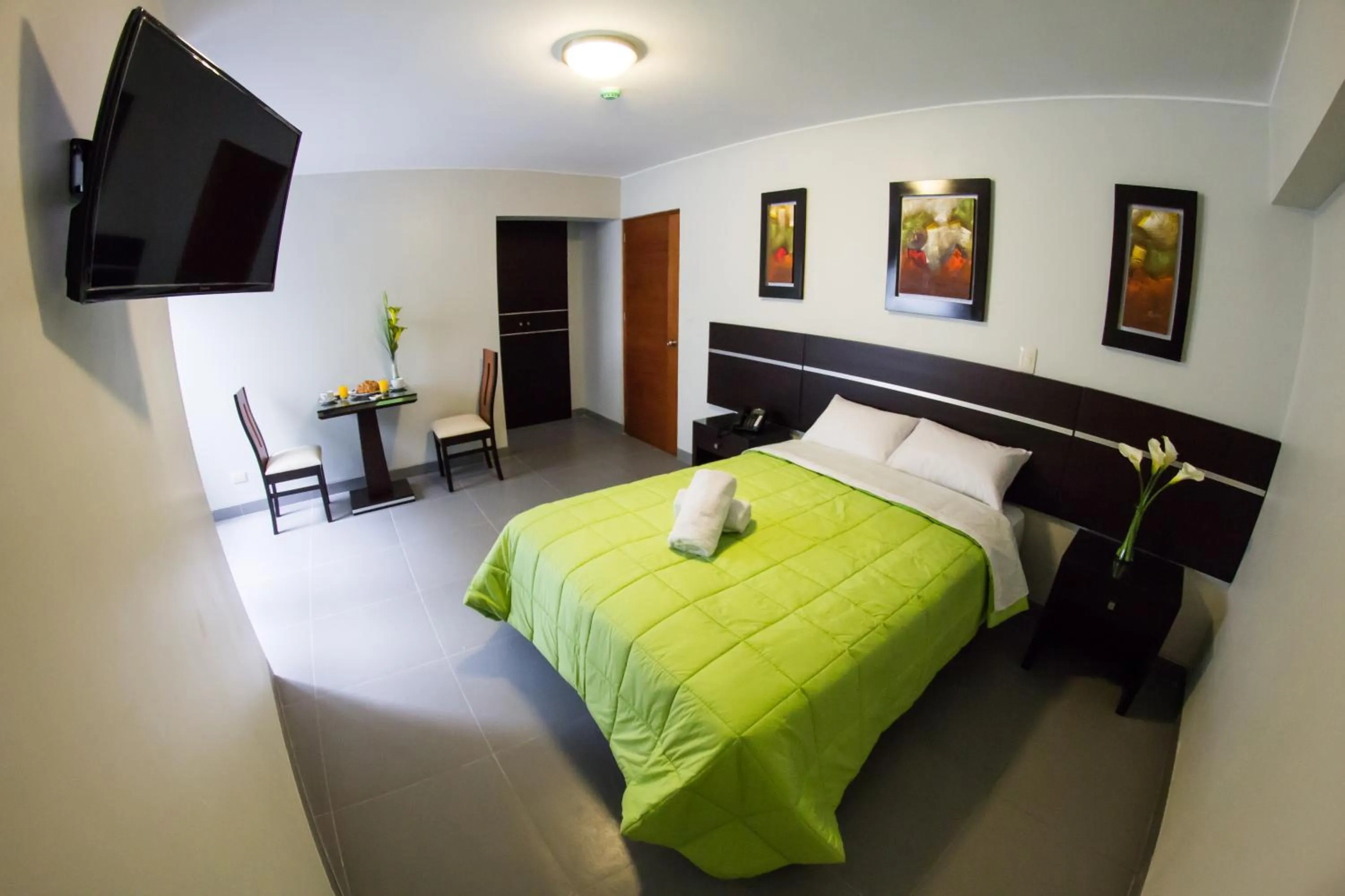 Photo of the whole room, Bed in Mariategui Hotel & Suites