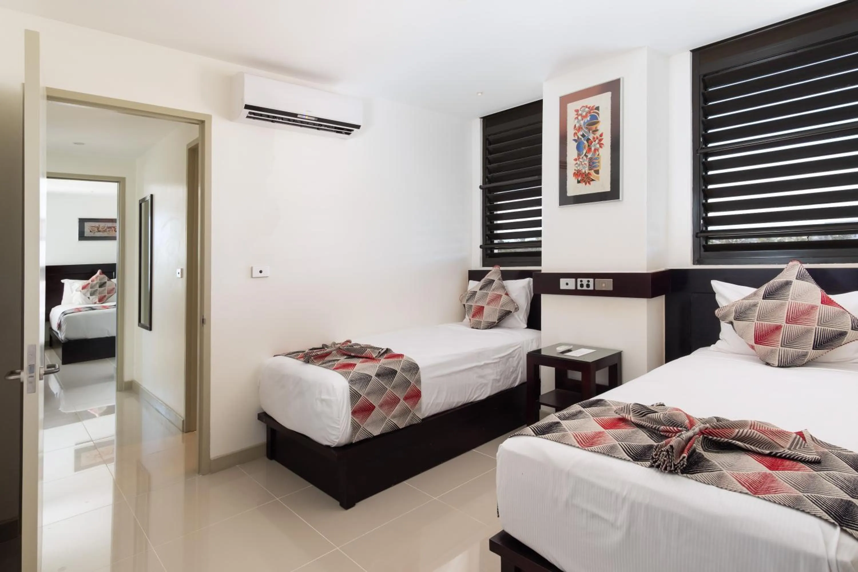 Bedroom, Bed in Ramada Suites by Wyndham Wailoaloa Beach Fiji