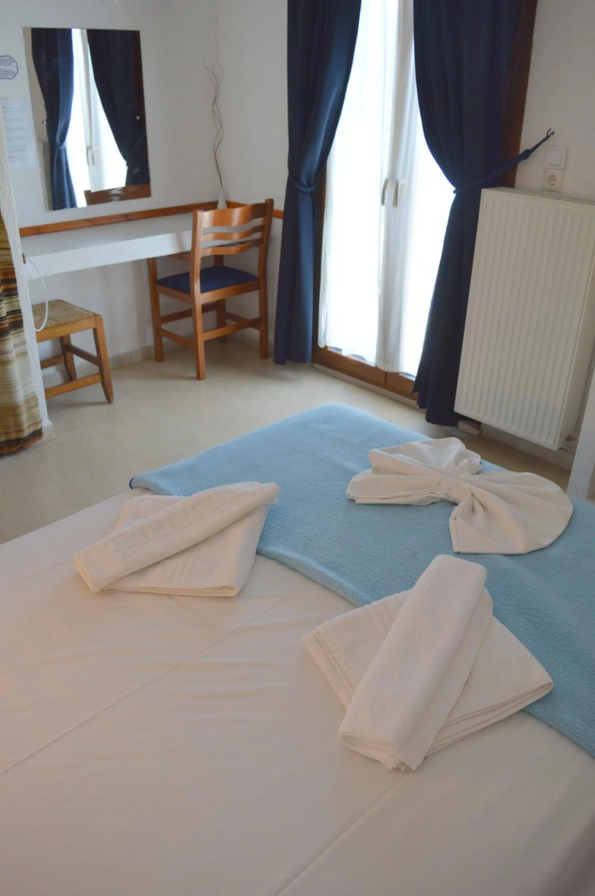 Bed in Mantraki Hotel Apartments