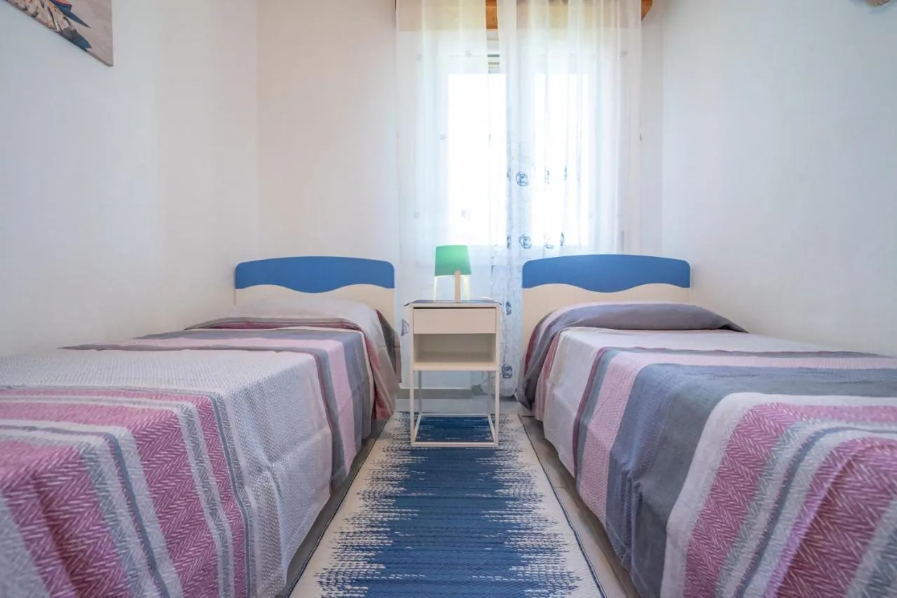 Bed in AZZURRO LIDO ADRIANO VISTA MARE