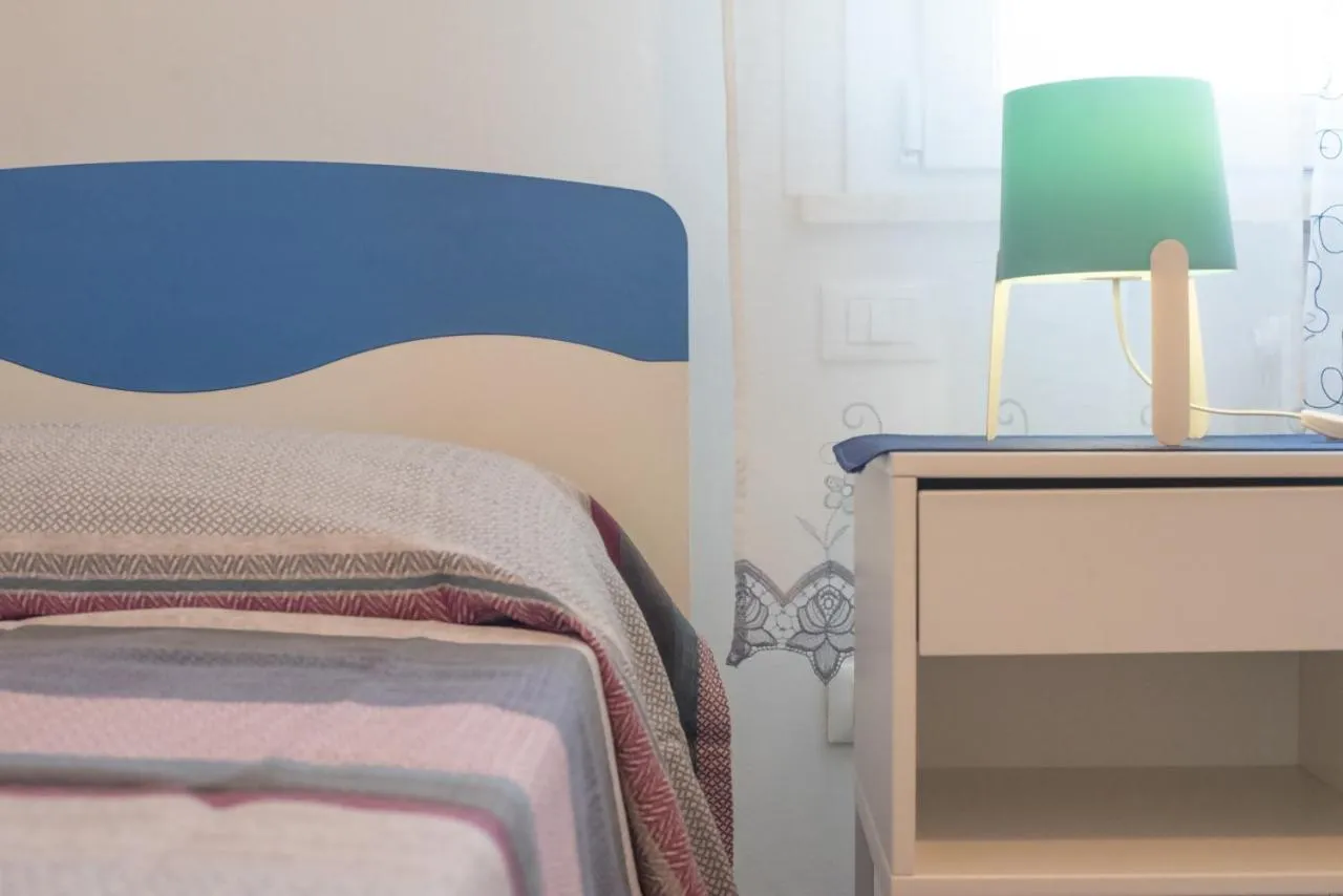 Photo of the whole room, Bed in AZZURRO LIDO ADRIANO VISTA MARE