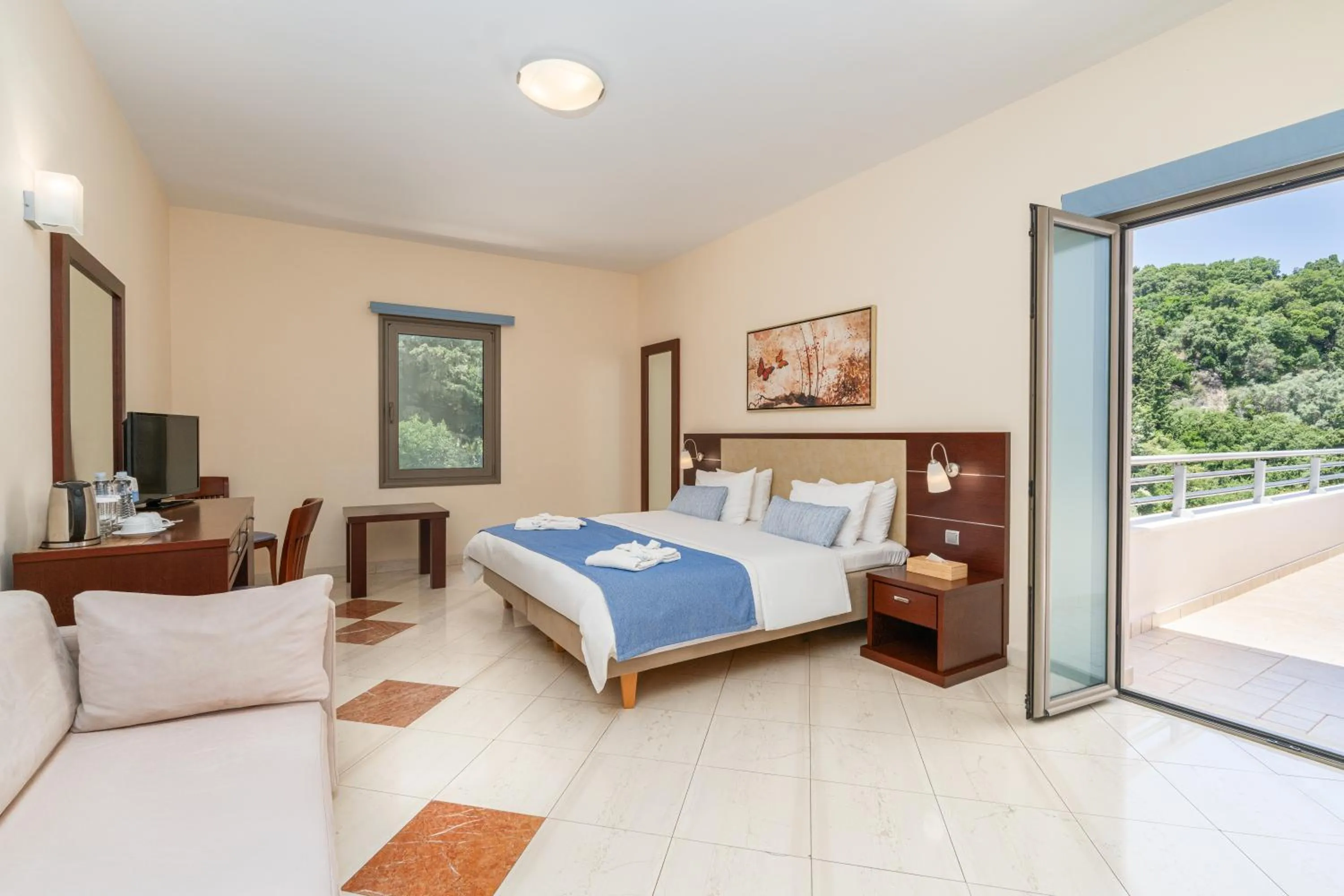 Bed in Porto Galini Seaside Resort & Spa