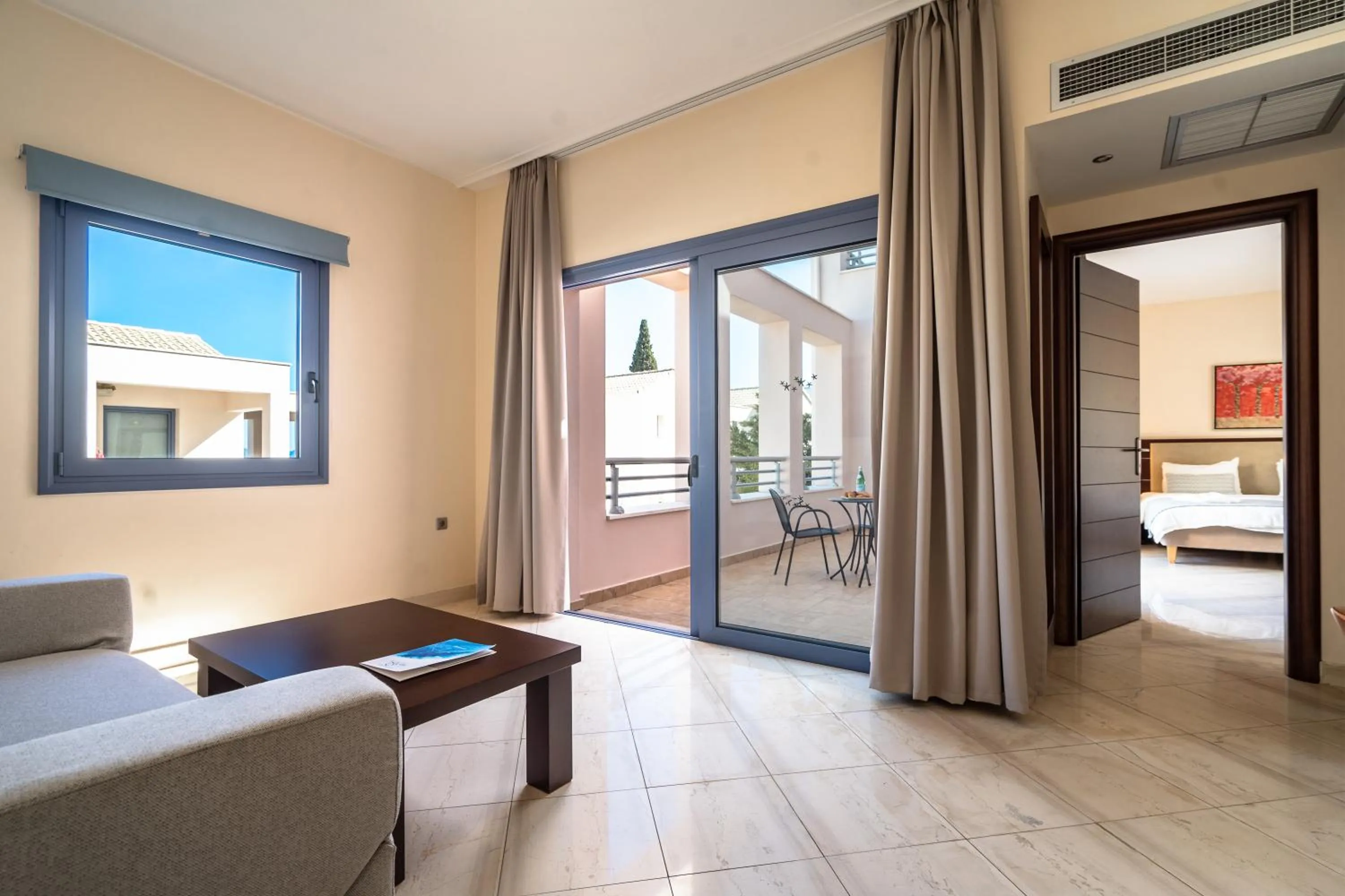 Seating area, Bed in Porto Galini Seaside Resort & Spa