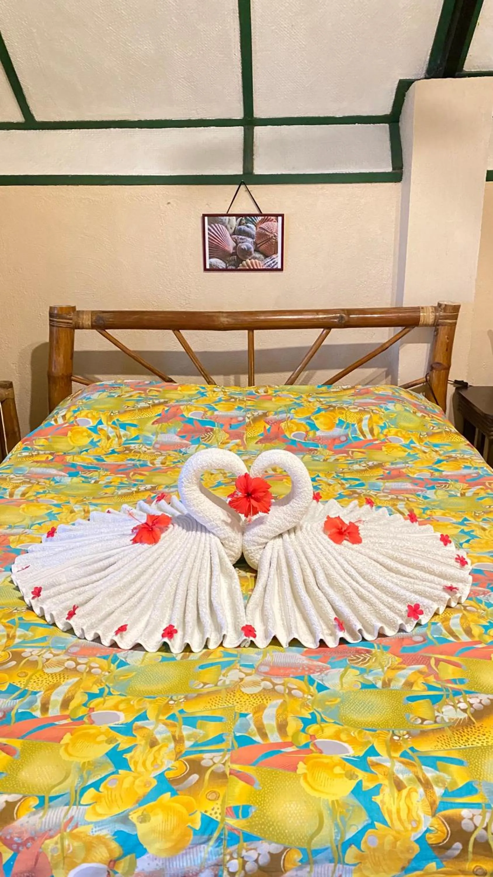 Bed in Ravenala Beach Bungalows