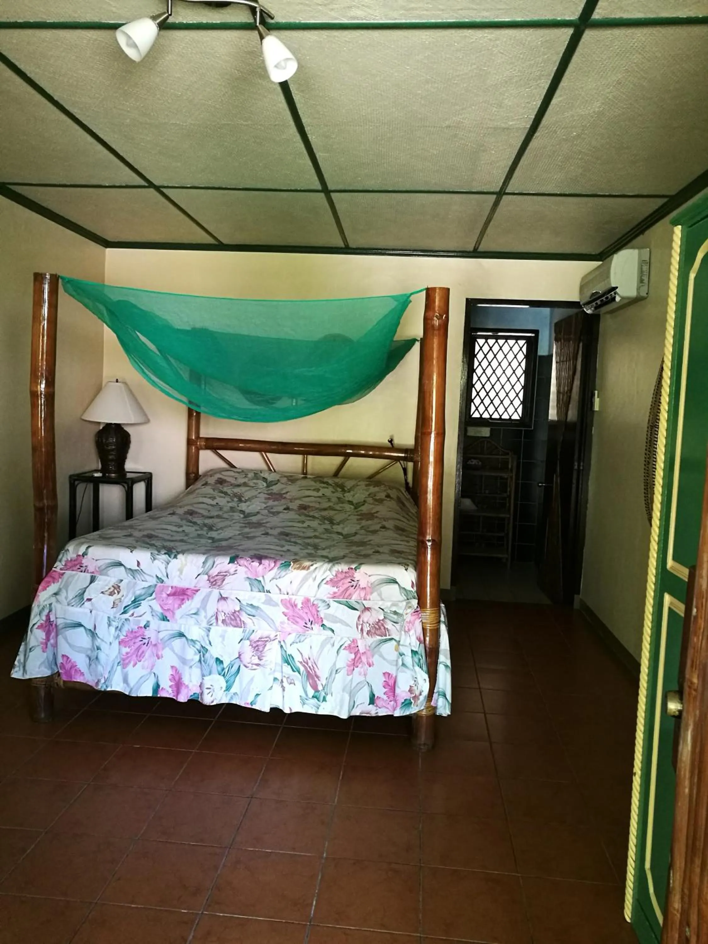 Bed in Ravenala Beach Bungalows