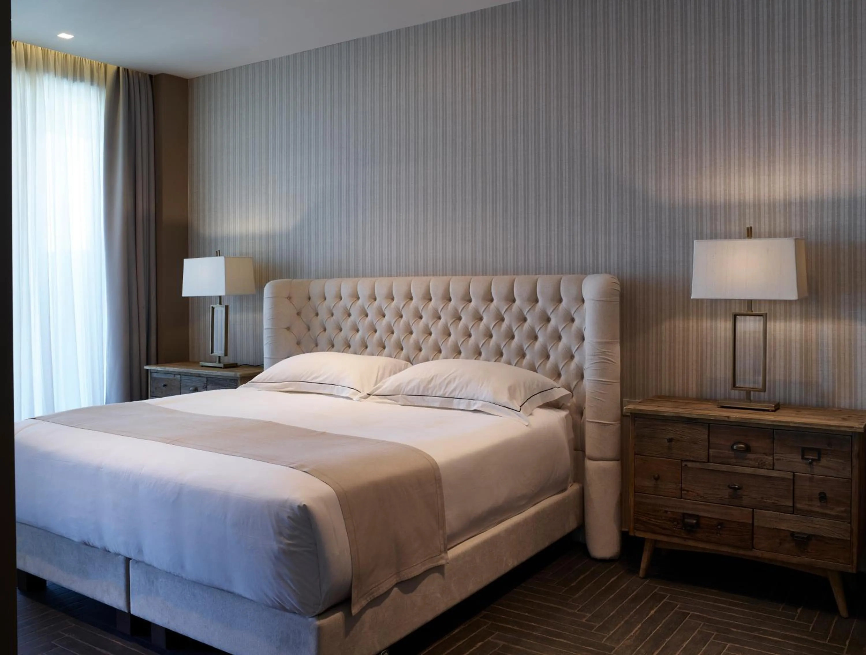 Bed in Pelagos Suites Hotel & Spa