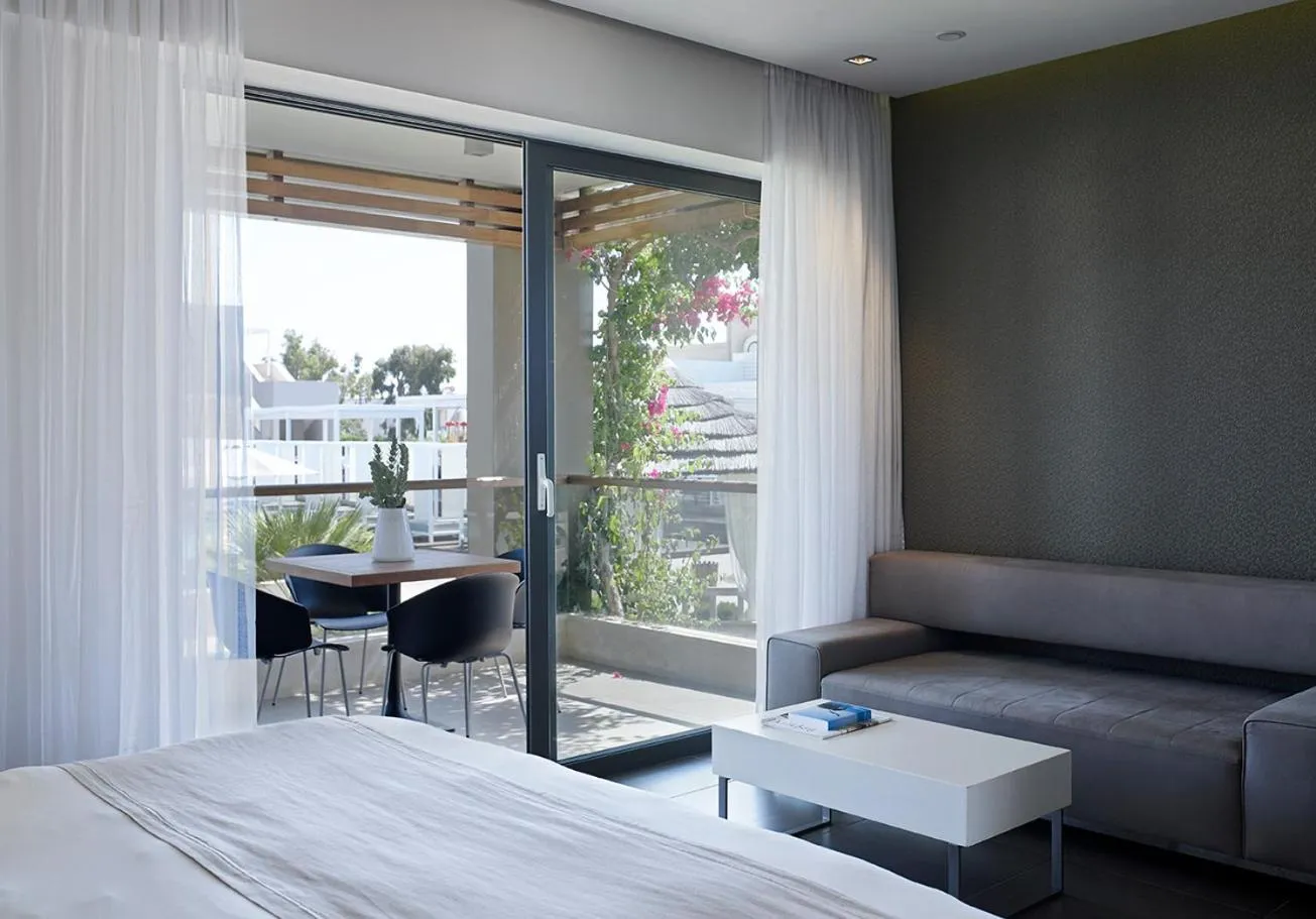 Photo of the whole room, Bed in Pelagos Suites Hotel & Spa