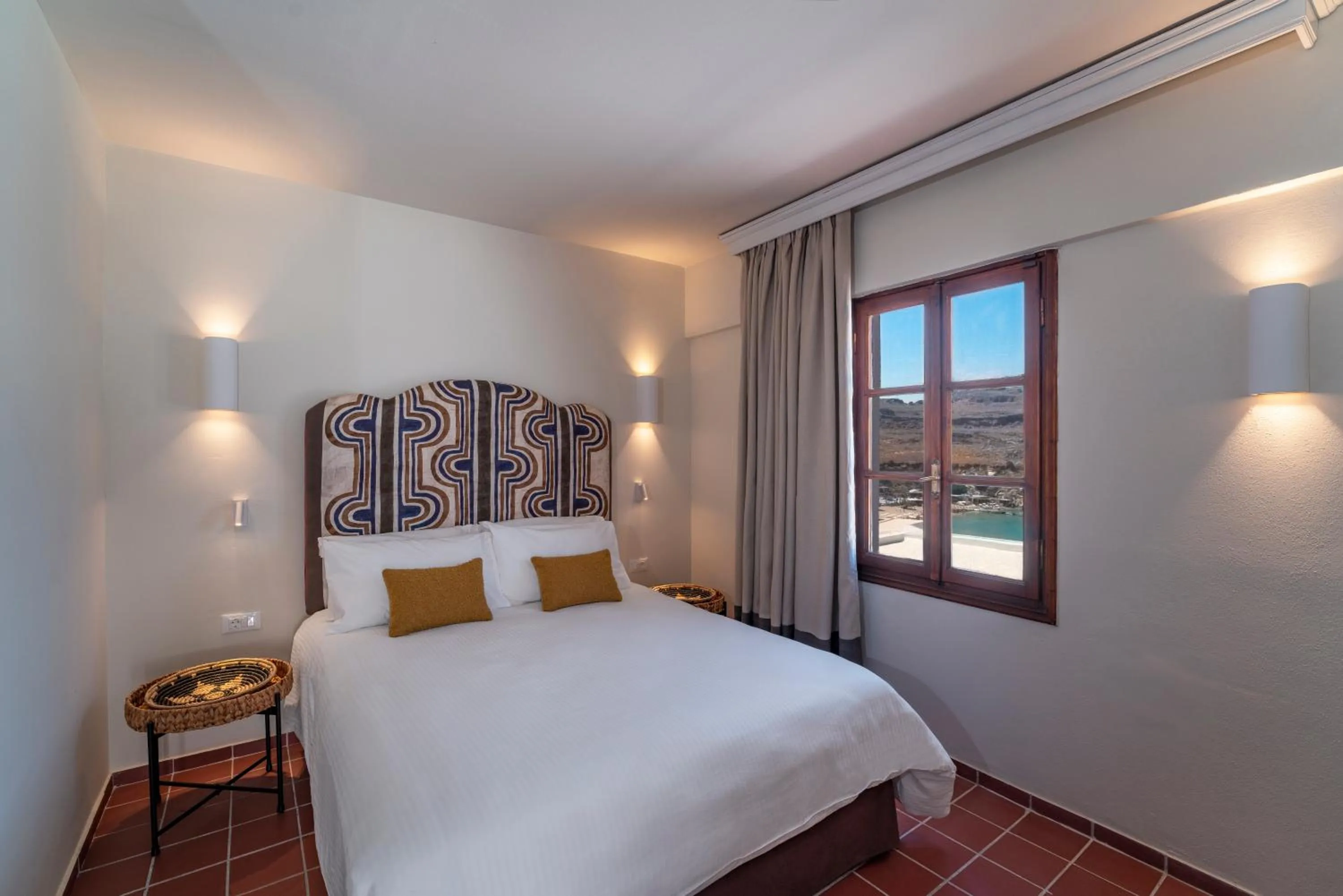 Bed in Maris Lindos Suites & Apartments