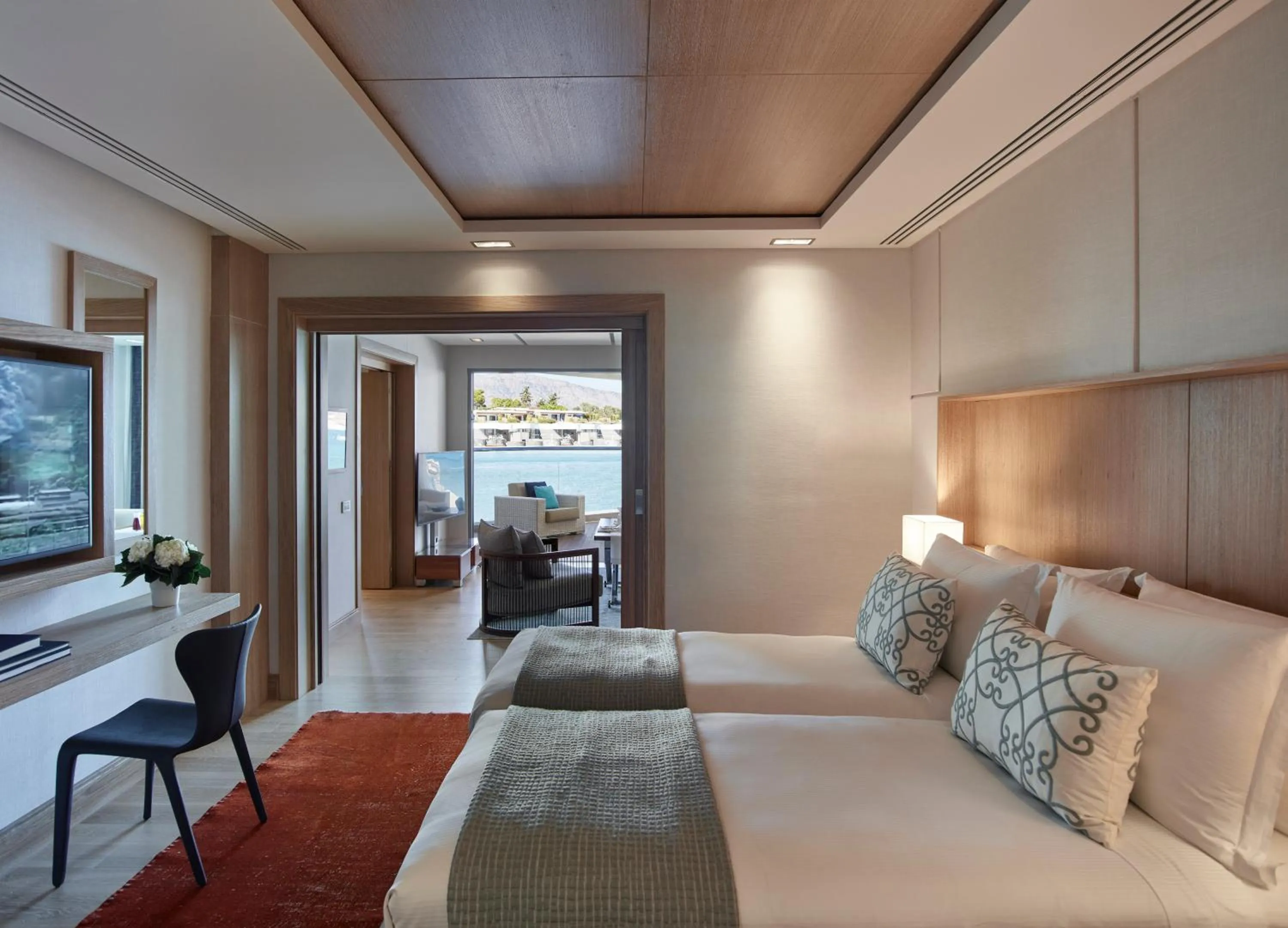 Seating area, Bed in Elounda Beach Hotel & Villas, a Member of the Leading Hotels of the World