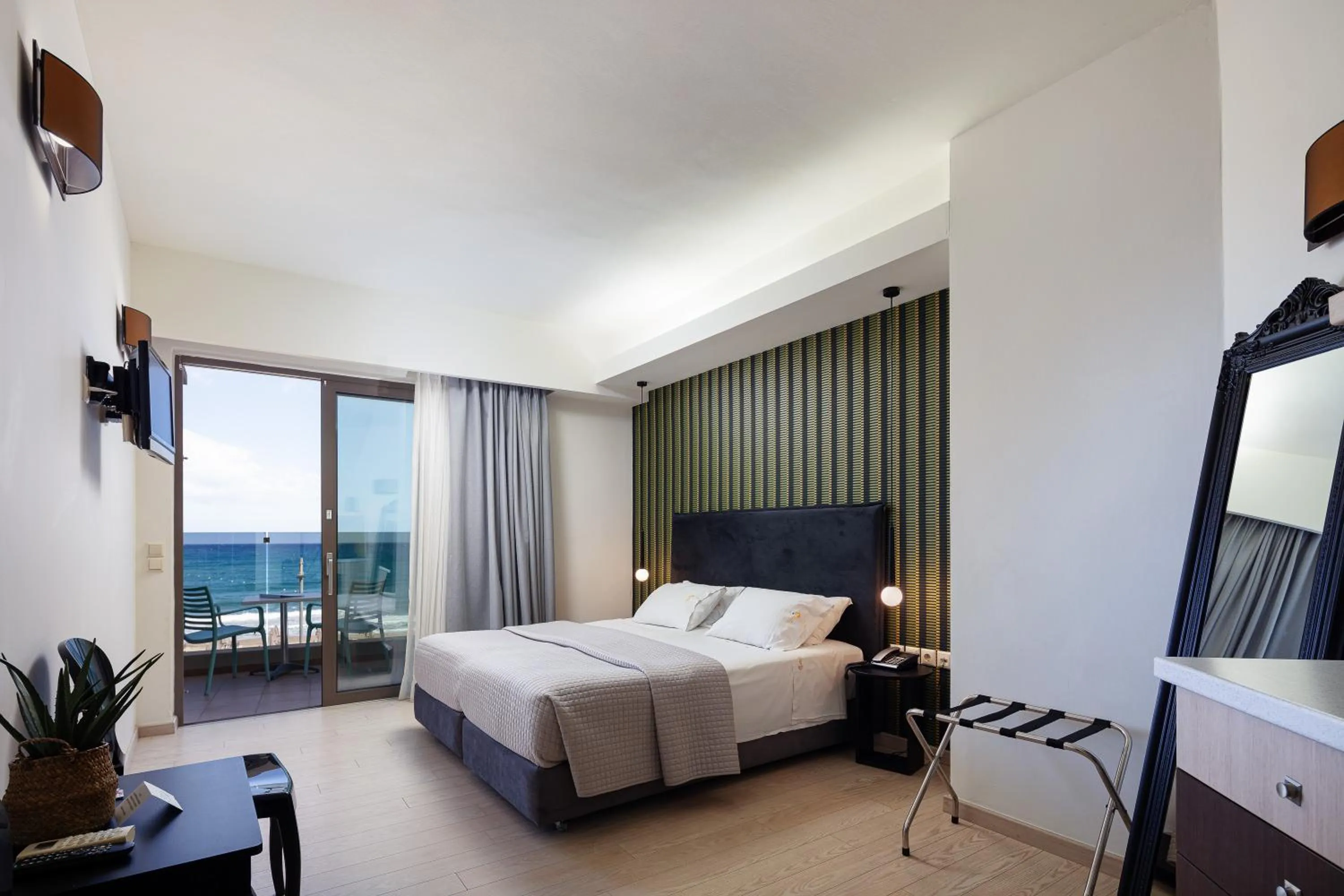 Bed in Steris Elegant Beach Hotel