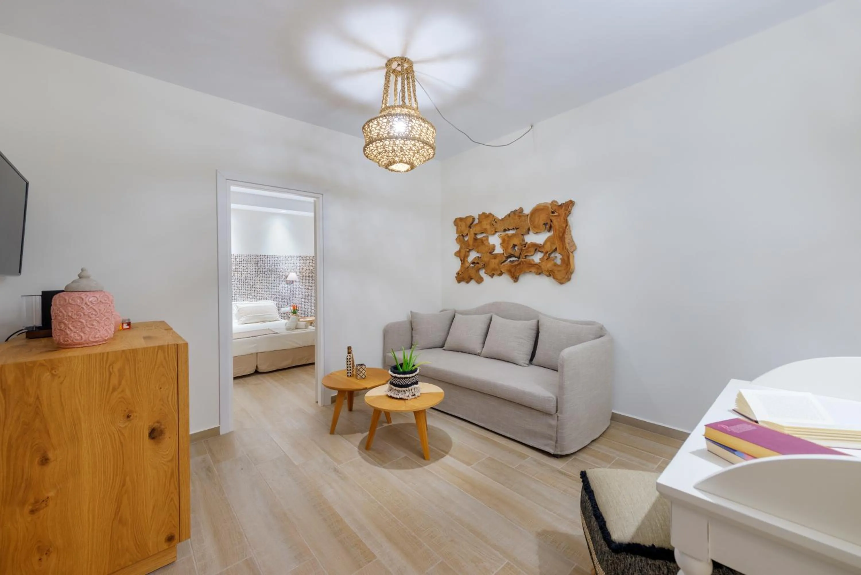 Seating area, Bed in Dolphin Bay Seaside Resort & Suites
