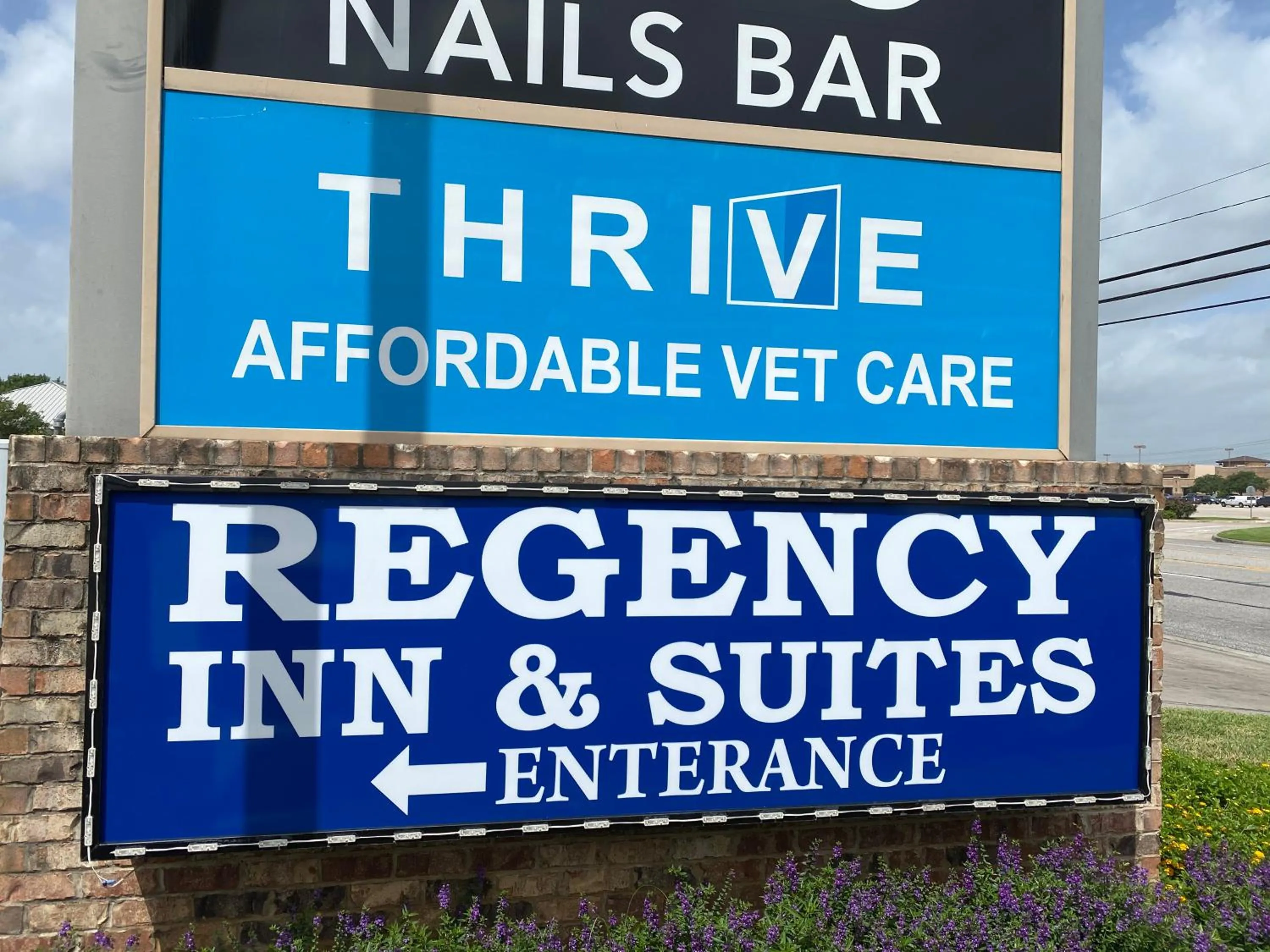 Property logo or sign in Regency Inn & Suites- NW Houston