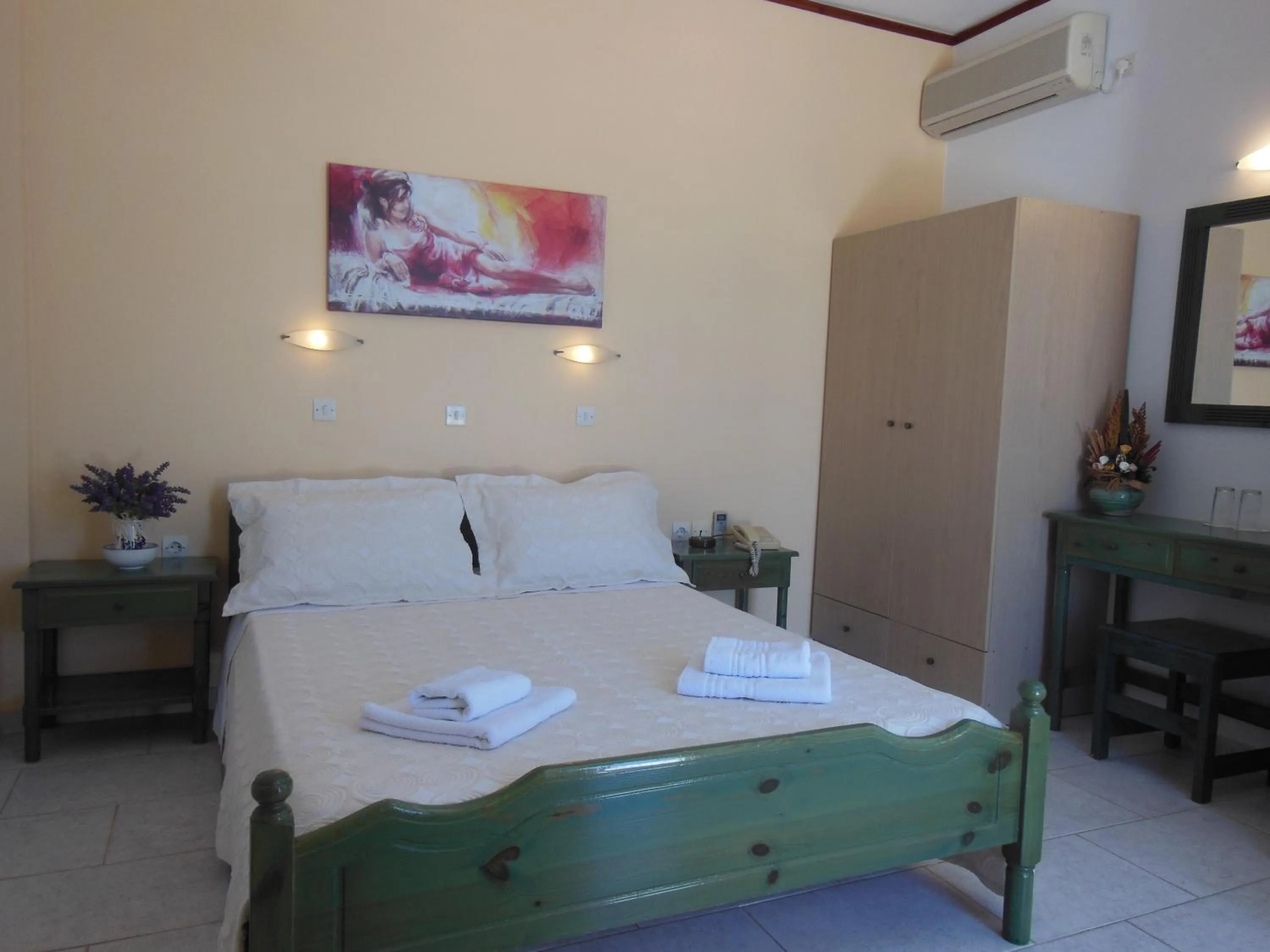 Bed in Poseidon Hotel