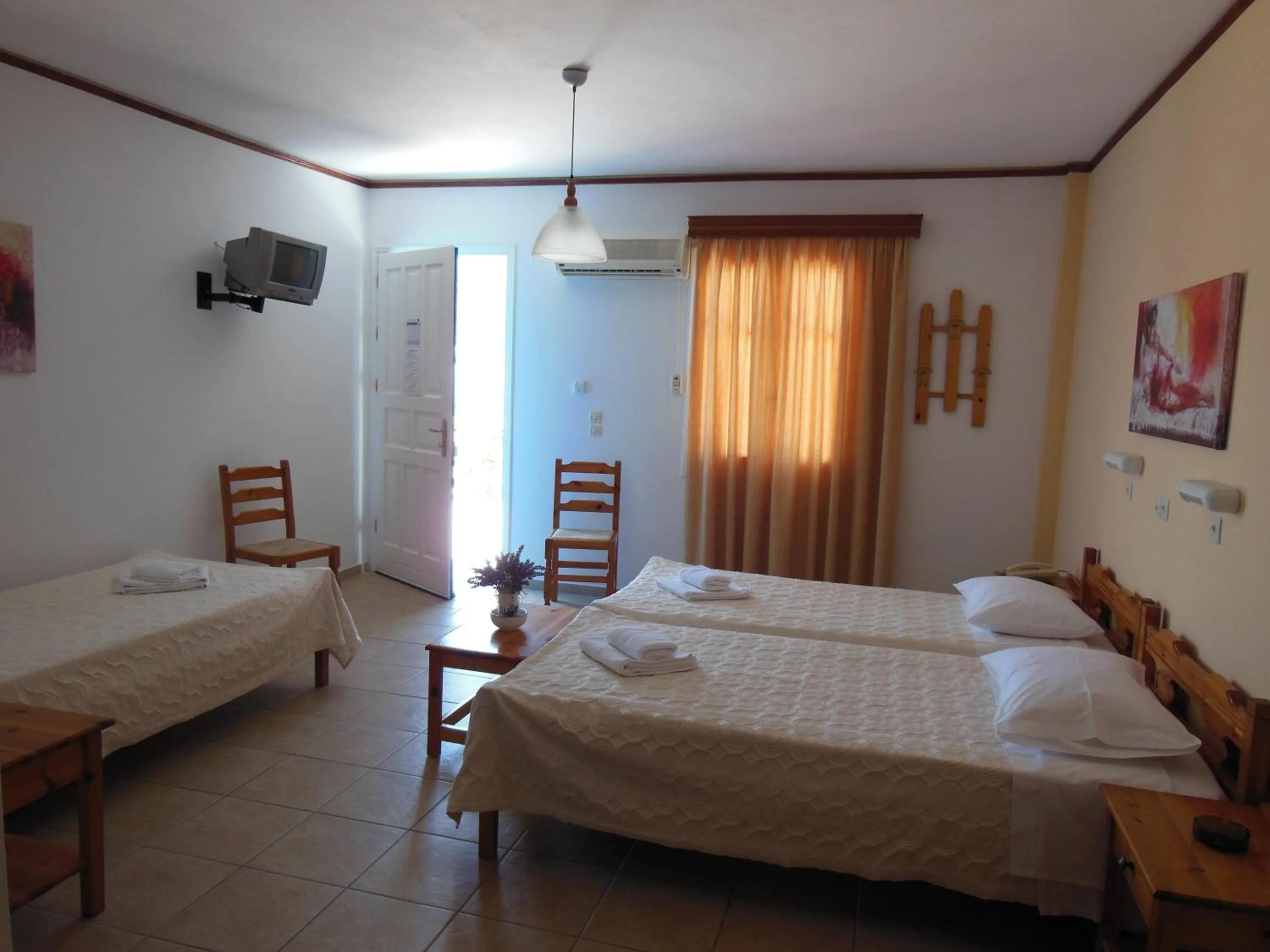 Bed in Poseidon Hotel