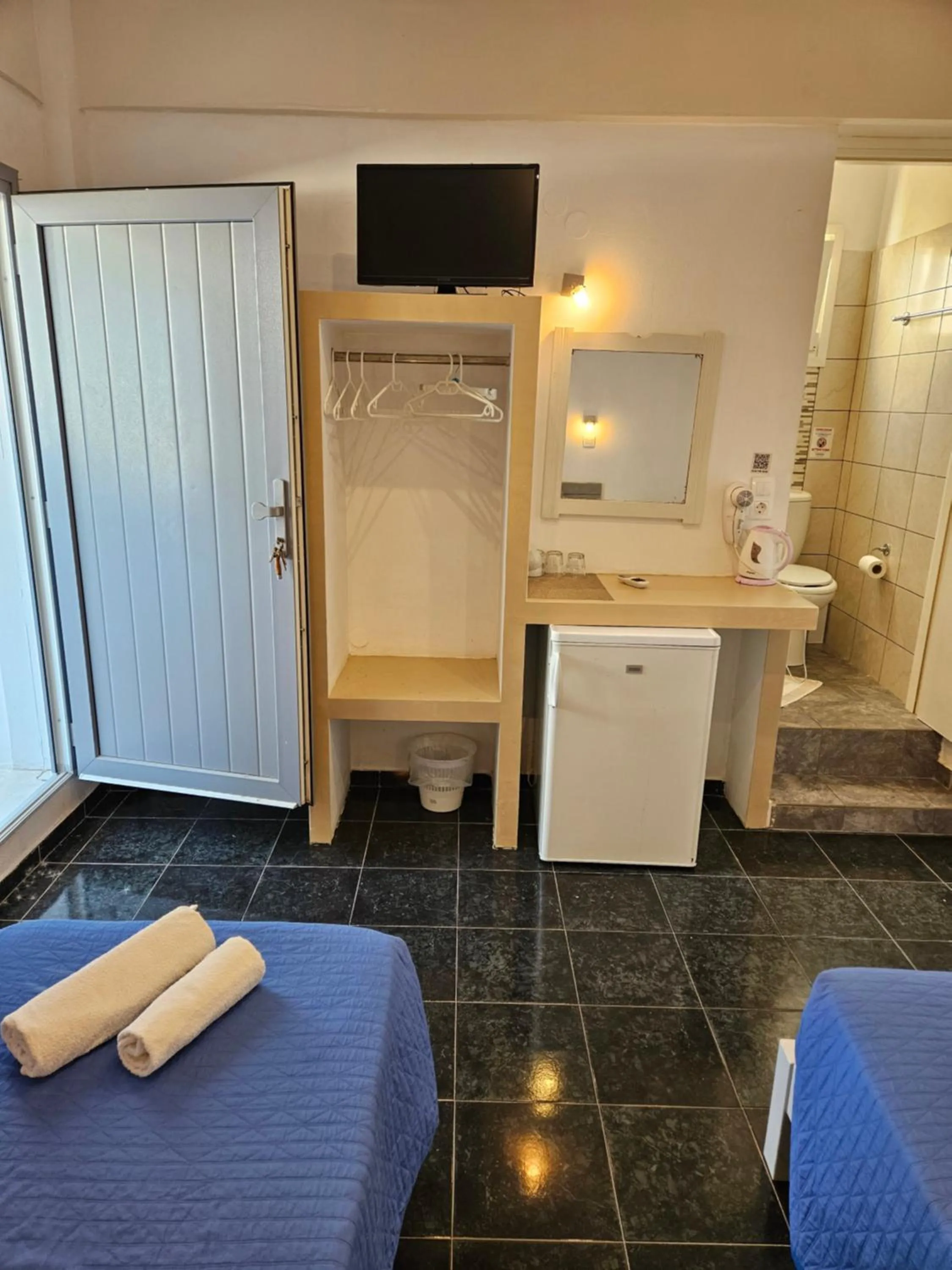 Bed in Skala Sunset Hotel and spa