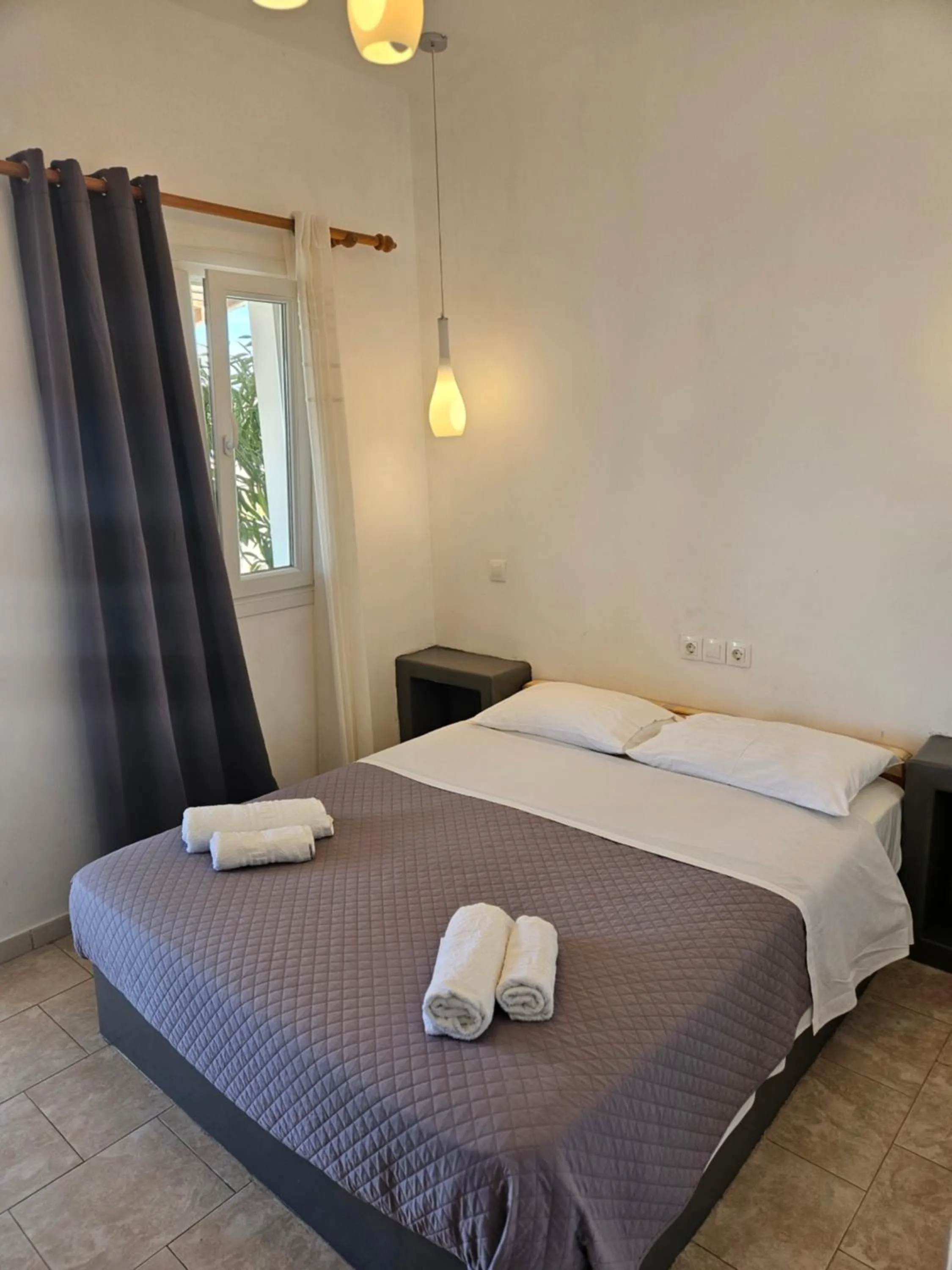 Bed in Skala Sunset Hotel and spa