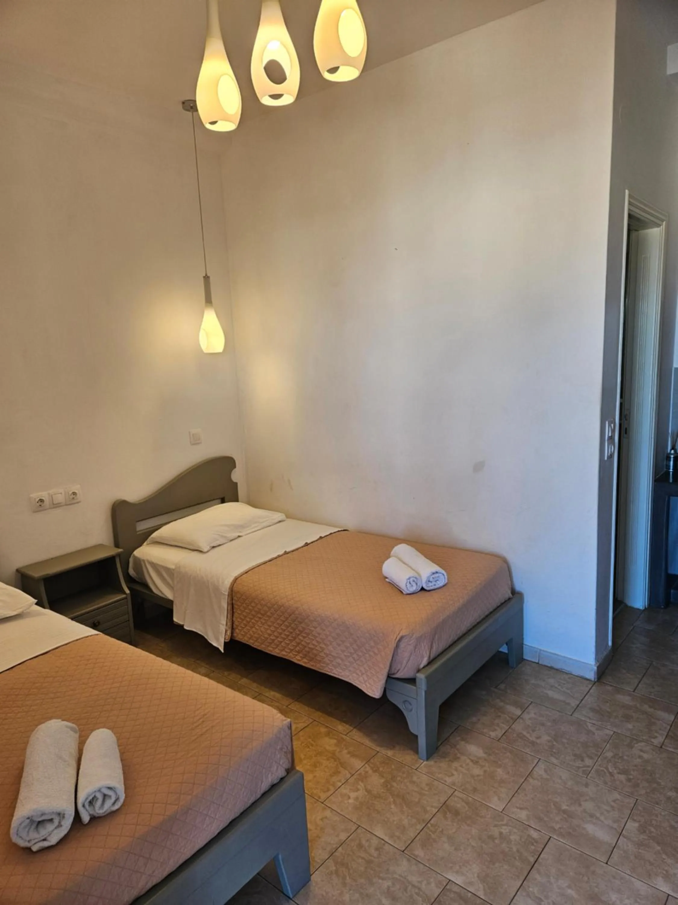 Bed in Skala Sunset Hotel and spa