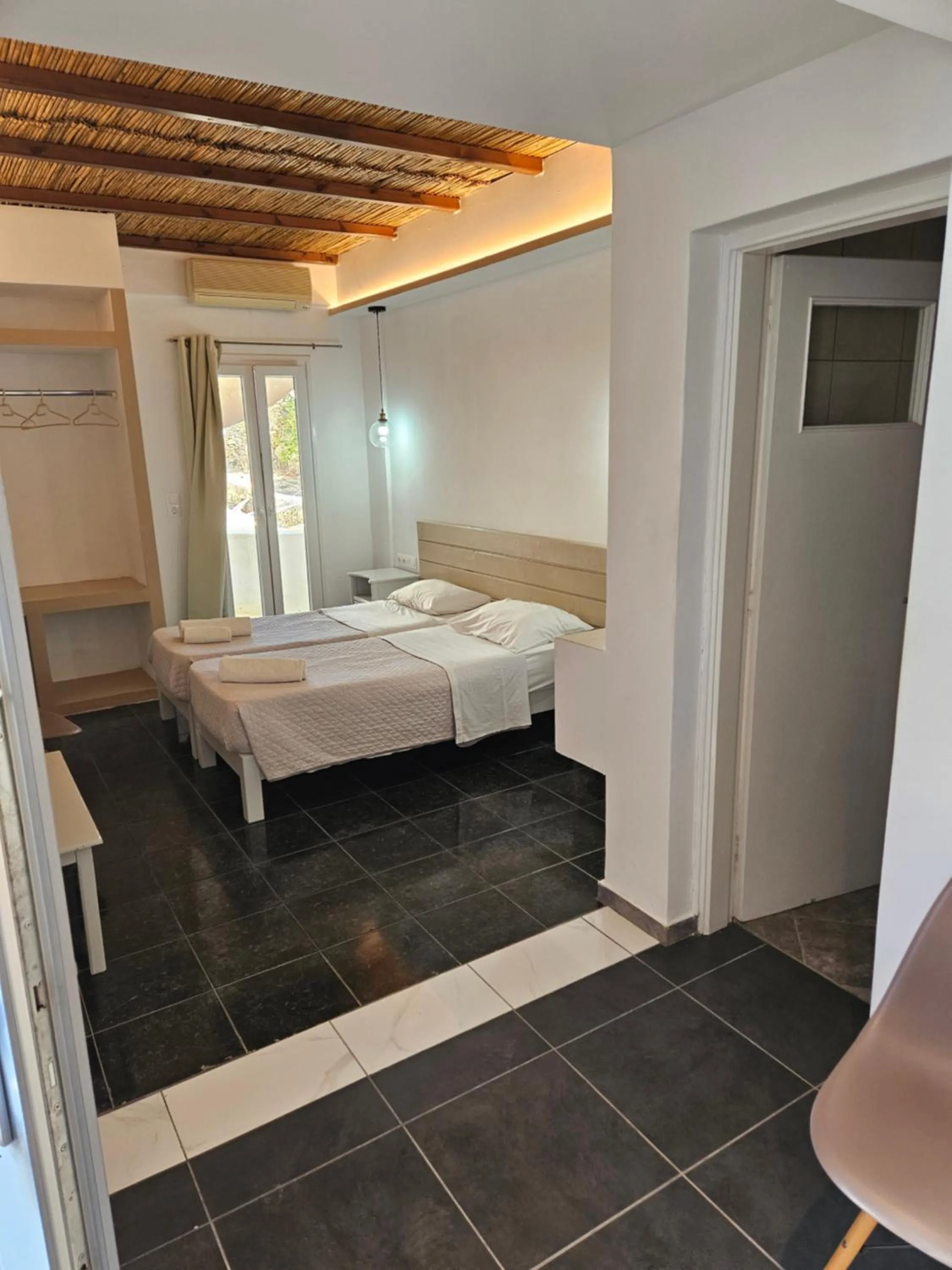 Bed in Skala Sunset Hotel and spa