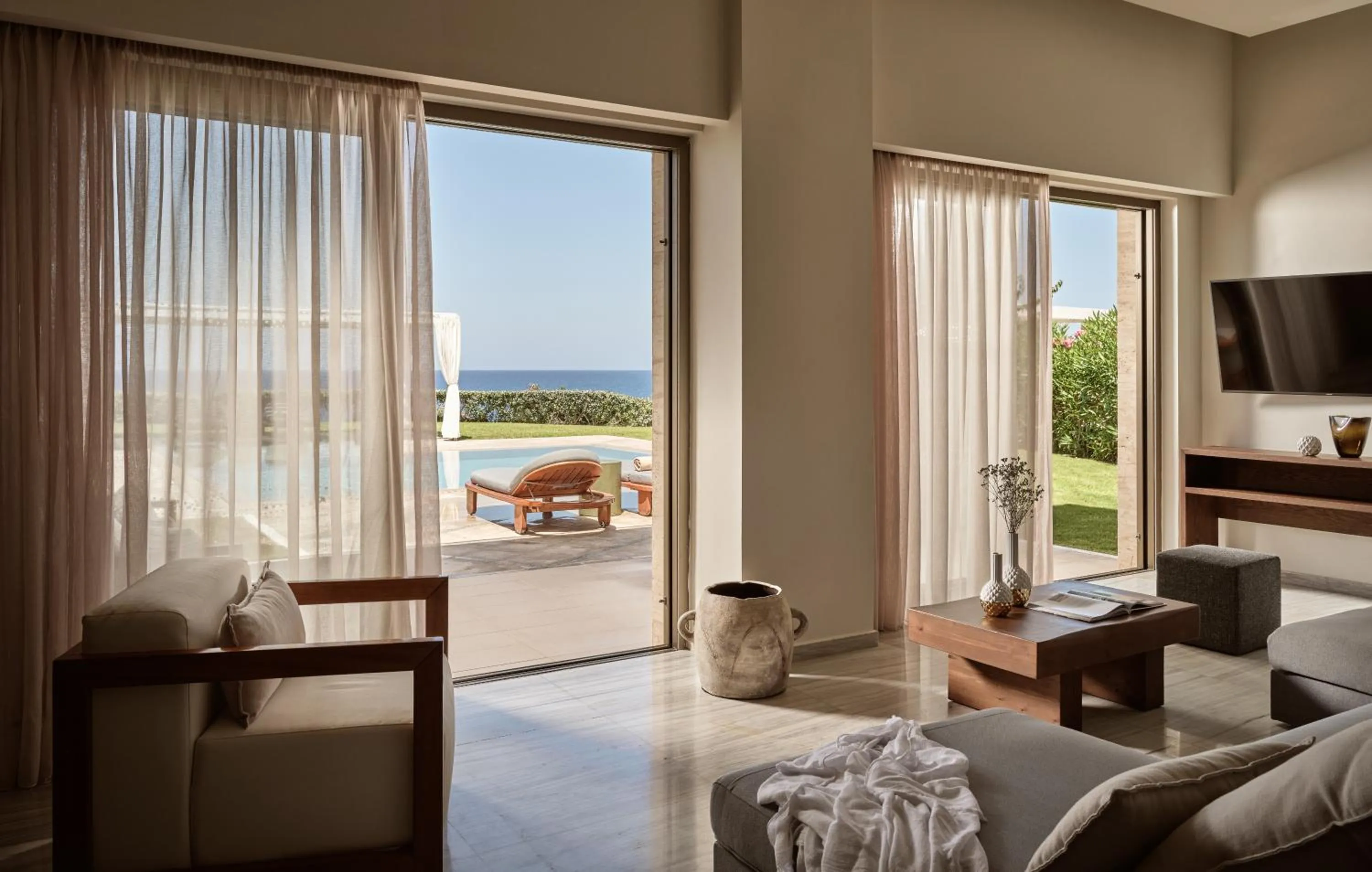 Living room, Bed in The Royal Blue a Luxury Beach Resort