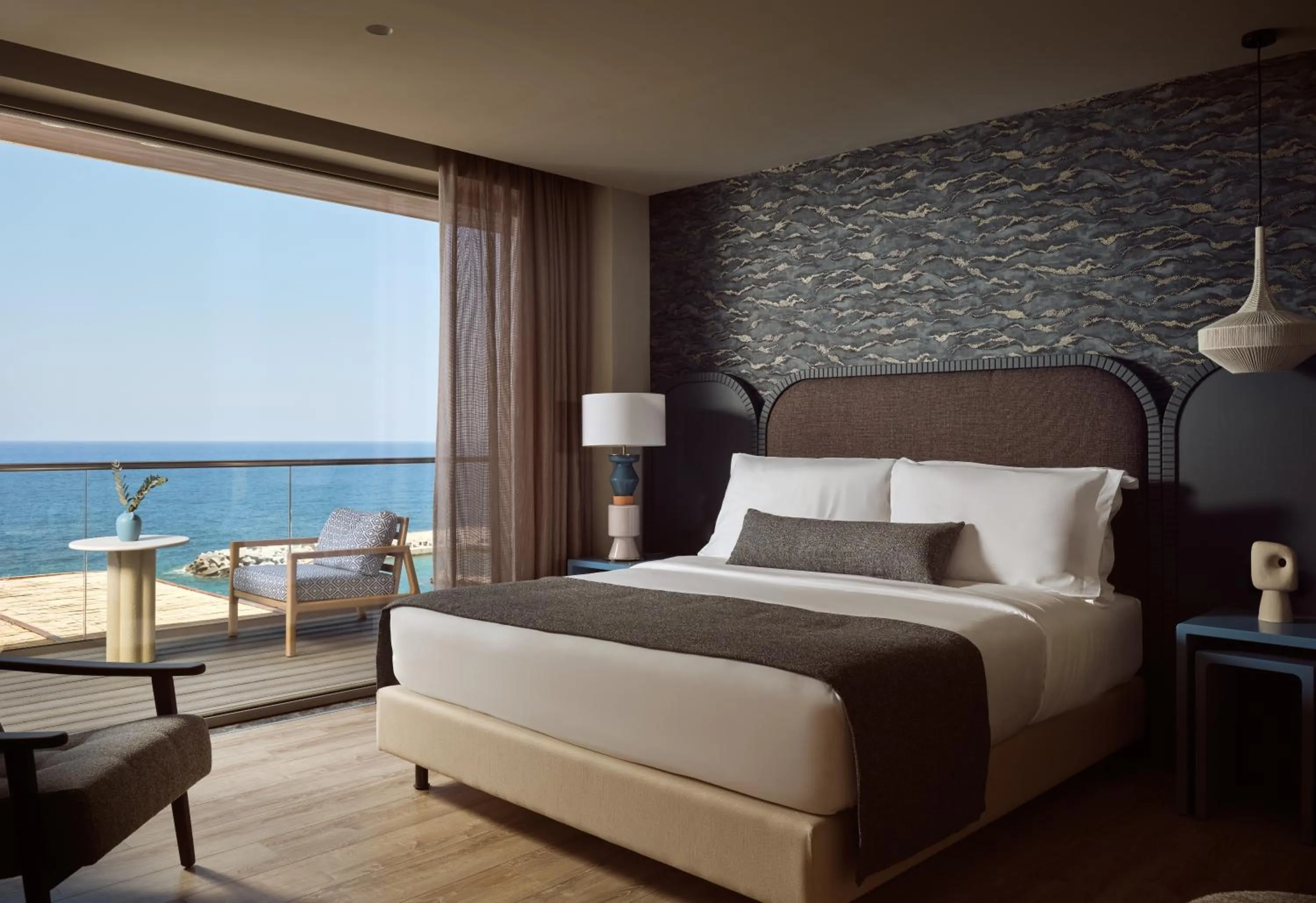 Bed in The Royal Blue a Luxury Beach Resort