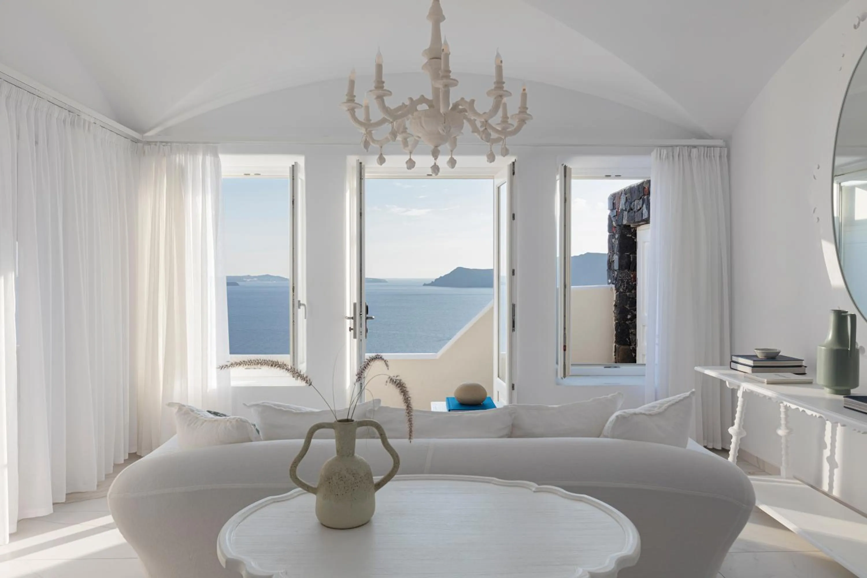 Living room, Bed in Canaves Oia Suites - Small Luxury Hotels of the World