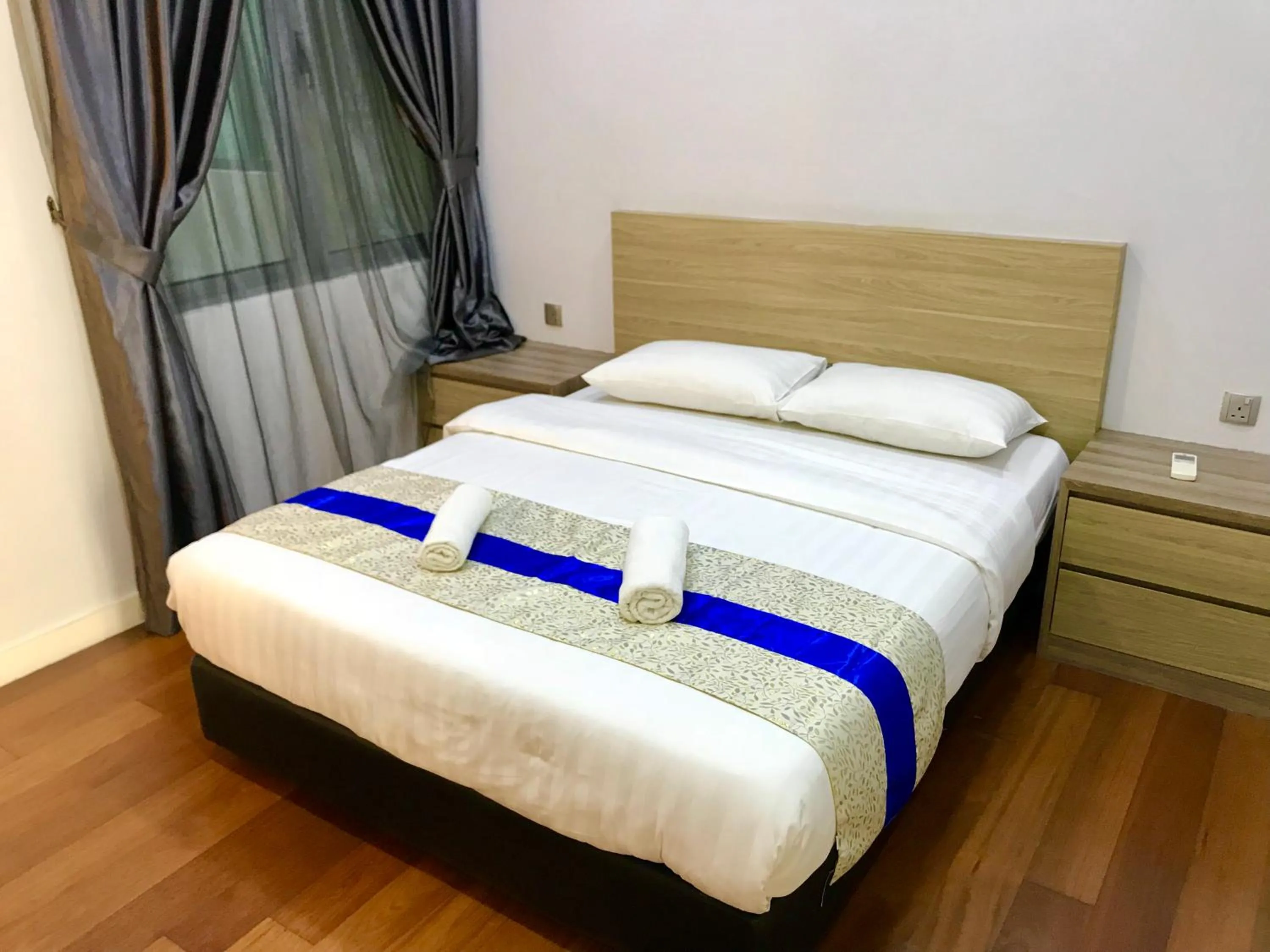 Bedroom, Bed in Sunset Seaview Vacation Condos @ IMAGO Shopping Mall