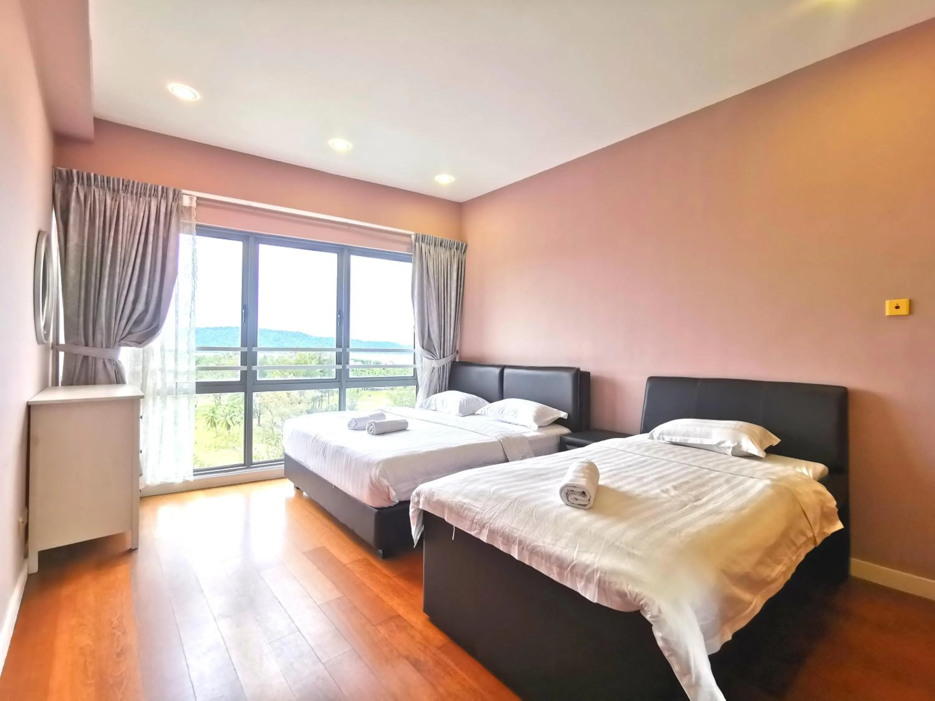 Bed in Sunset Seaview Vacation Condos @ IMAGO Shopping Mall