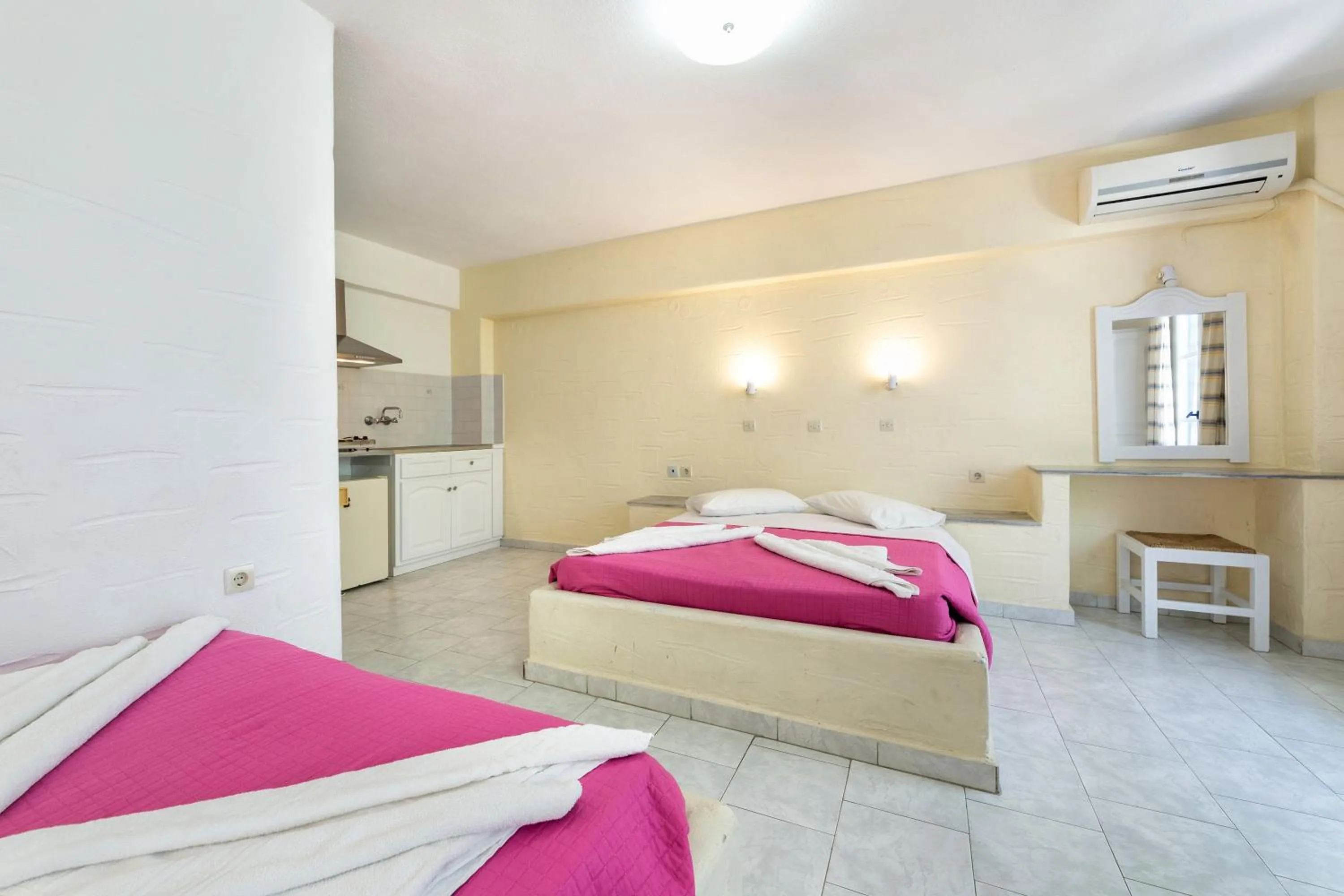 Bed in Stratos Apartments & Studios