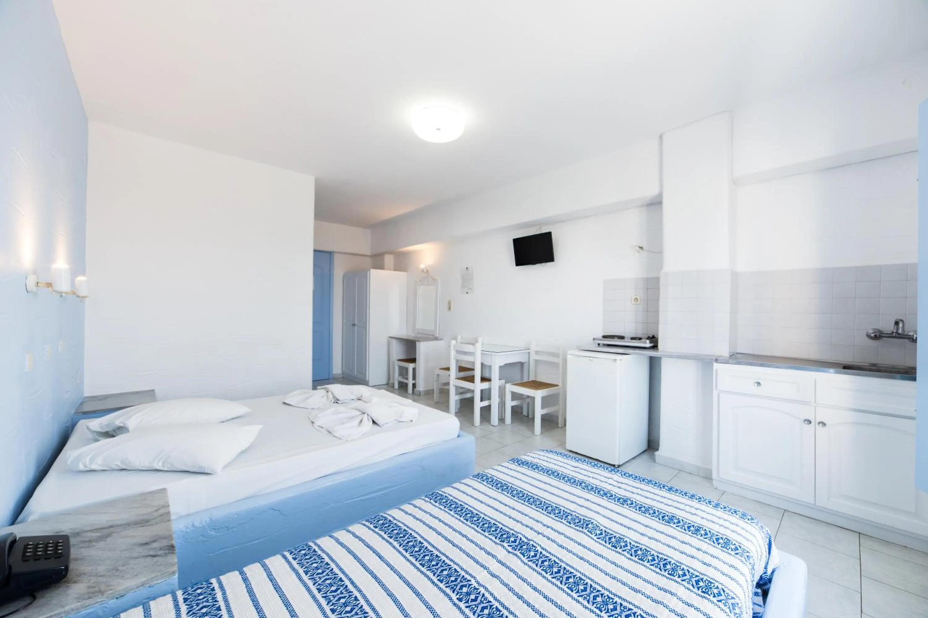 Bed in Stratos Apartments & Studios