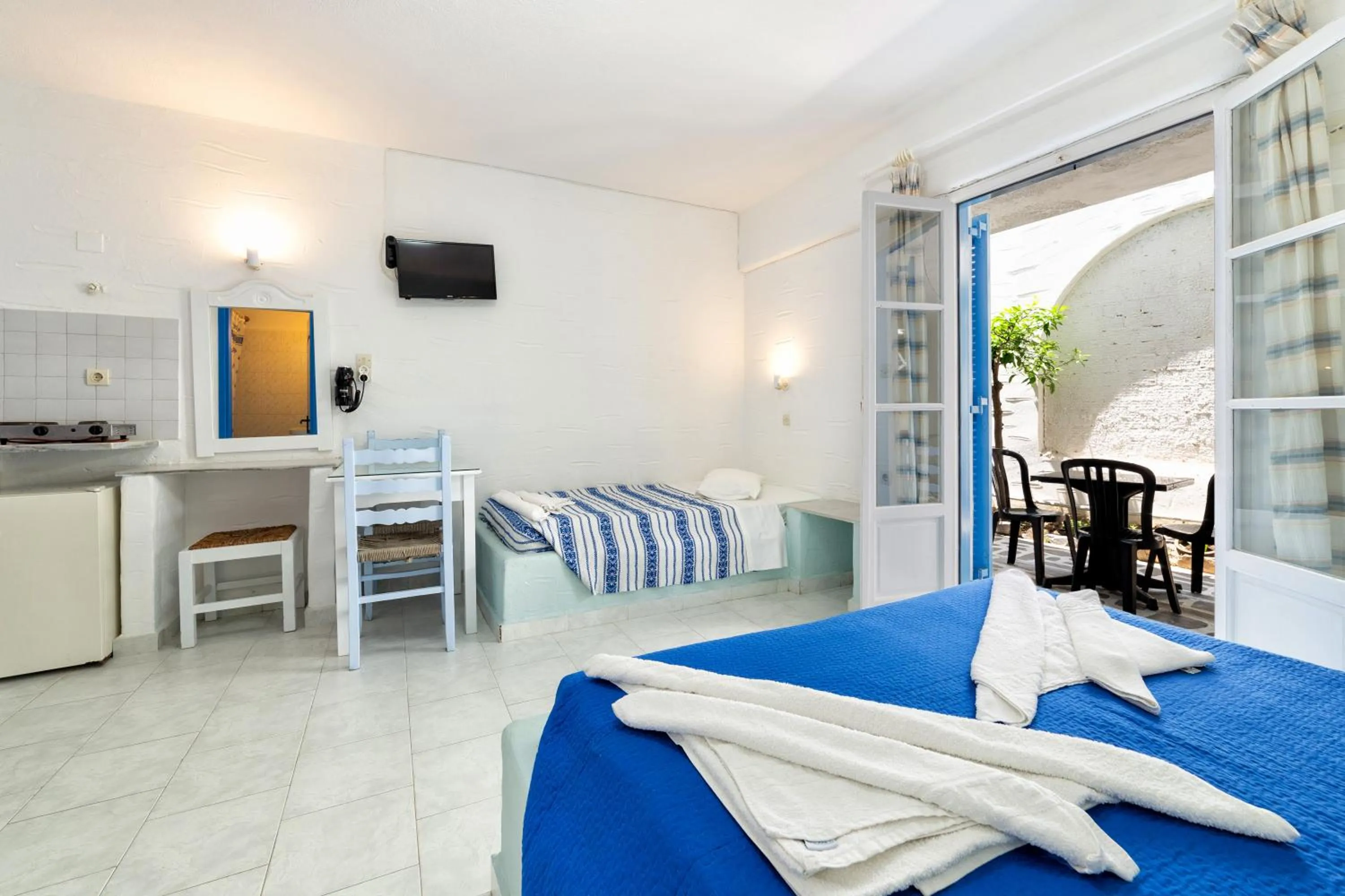 Bed in Stratos Apartments & Studios