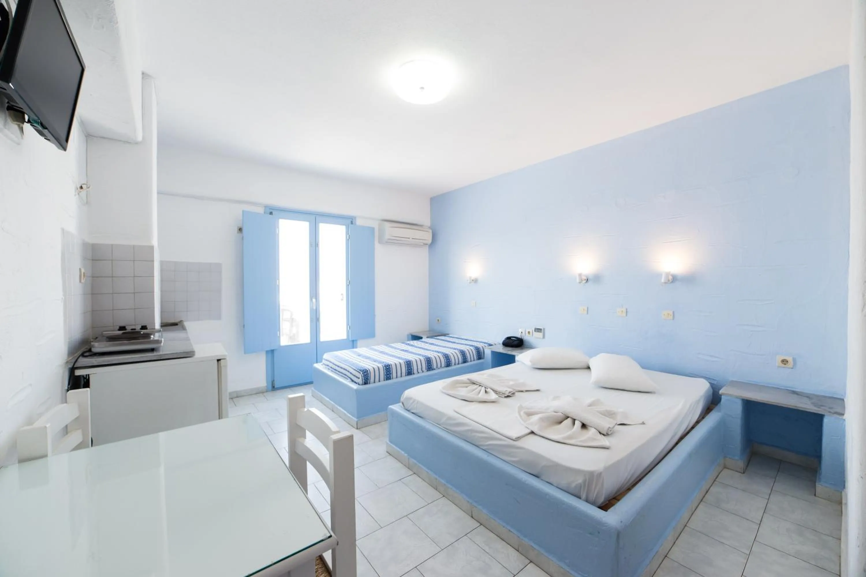 Bed in Stratos Apartments & Studios