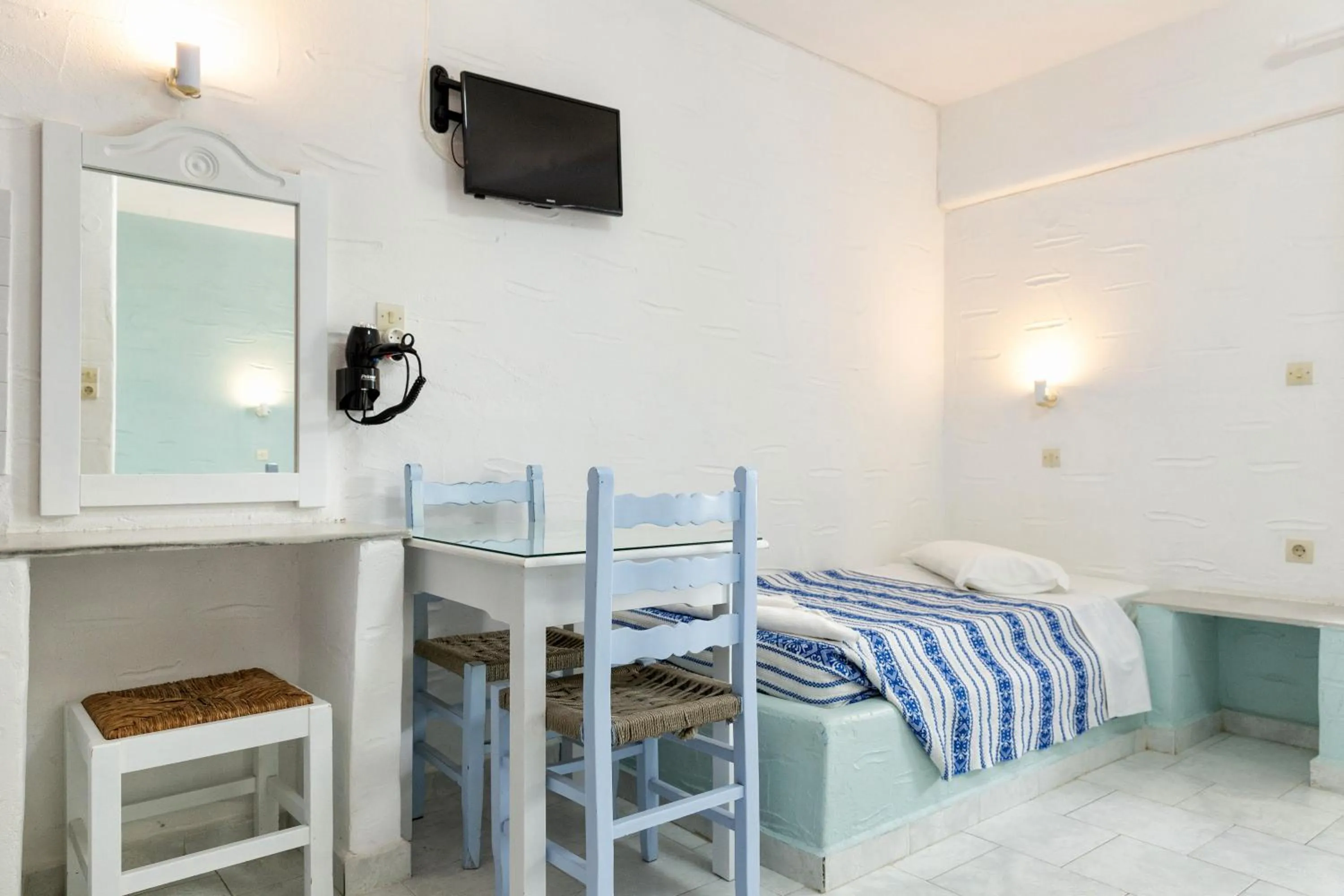 Bed in Stratos Apartments & Studios