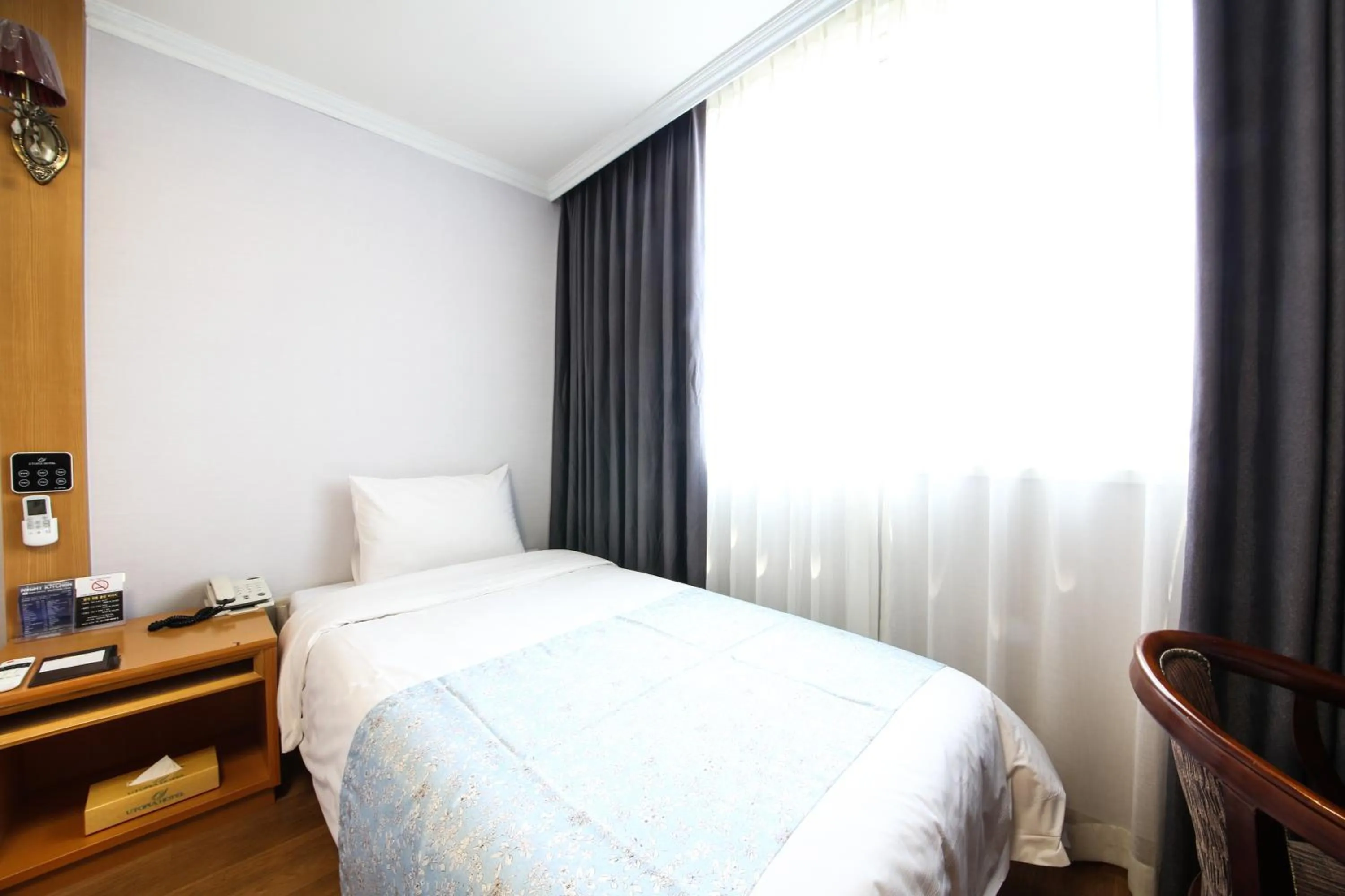 Bed in Utopia Tourist Hotel