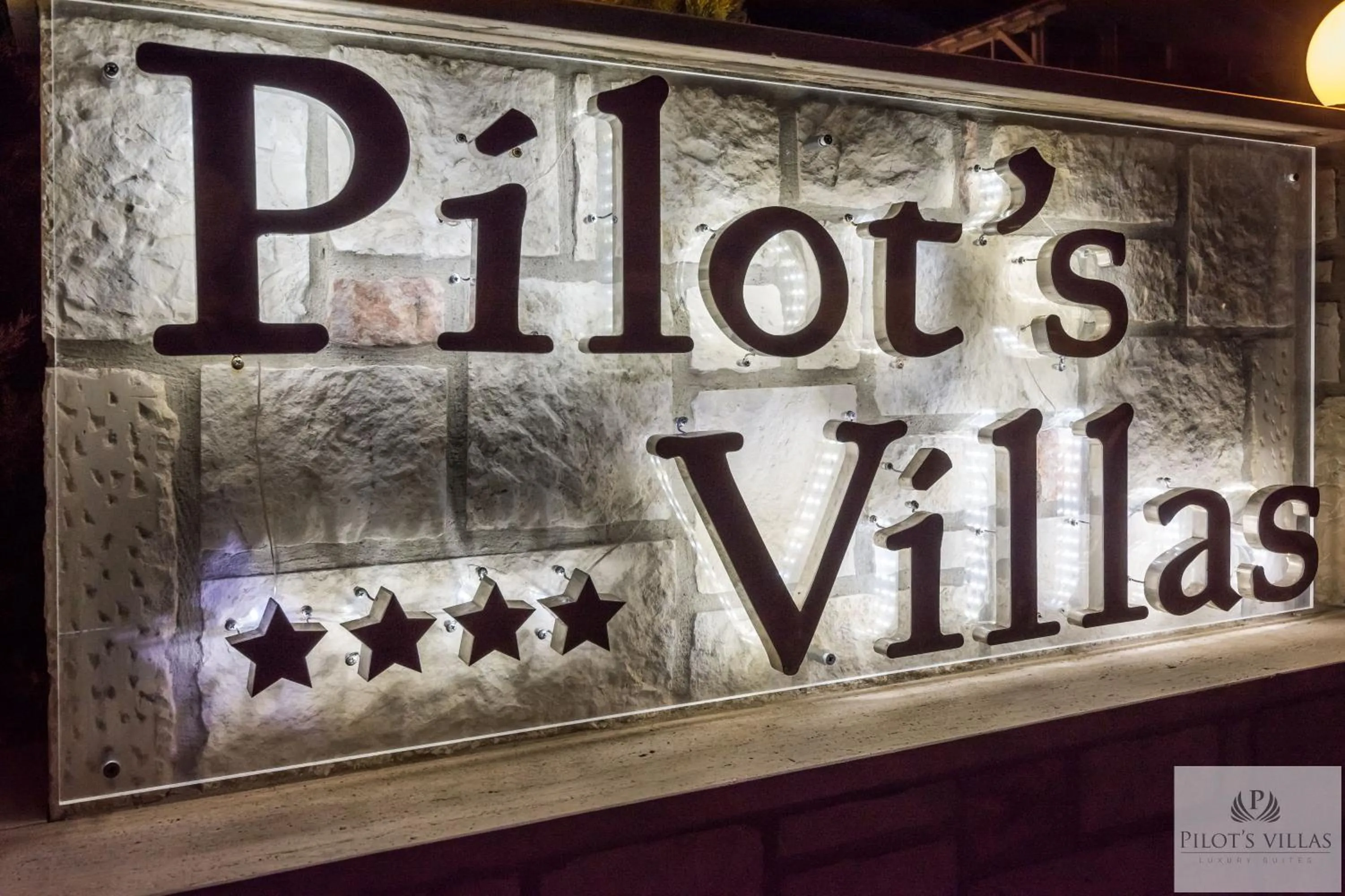 Property logo or sign in Pilot's Villas Luxury Suites