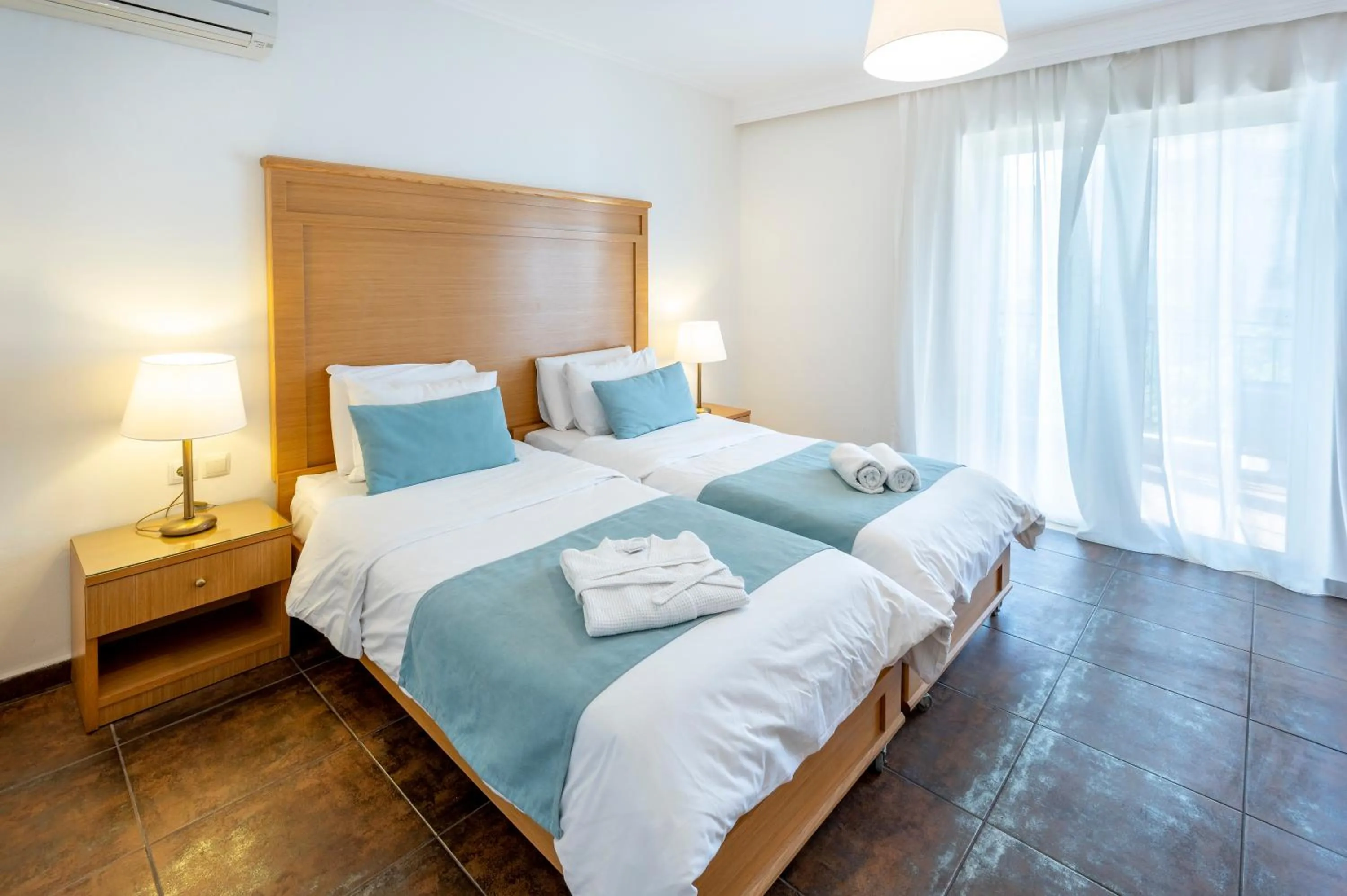 Bed in Peridis Family Resort