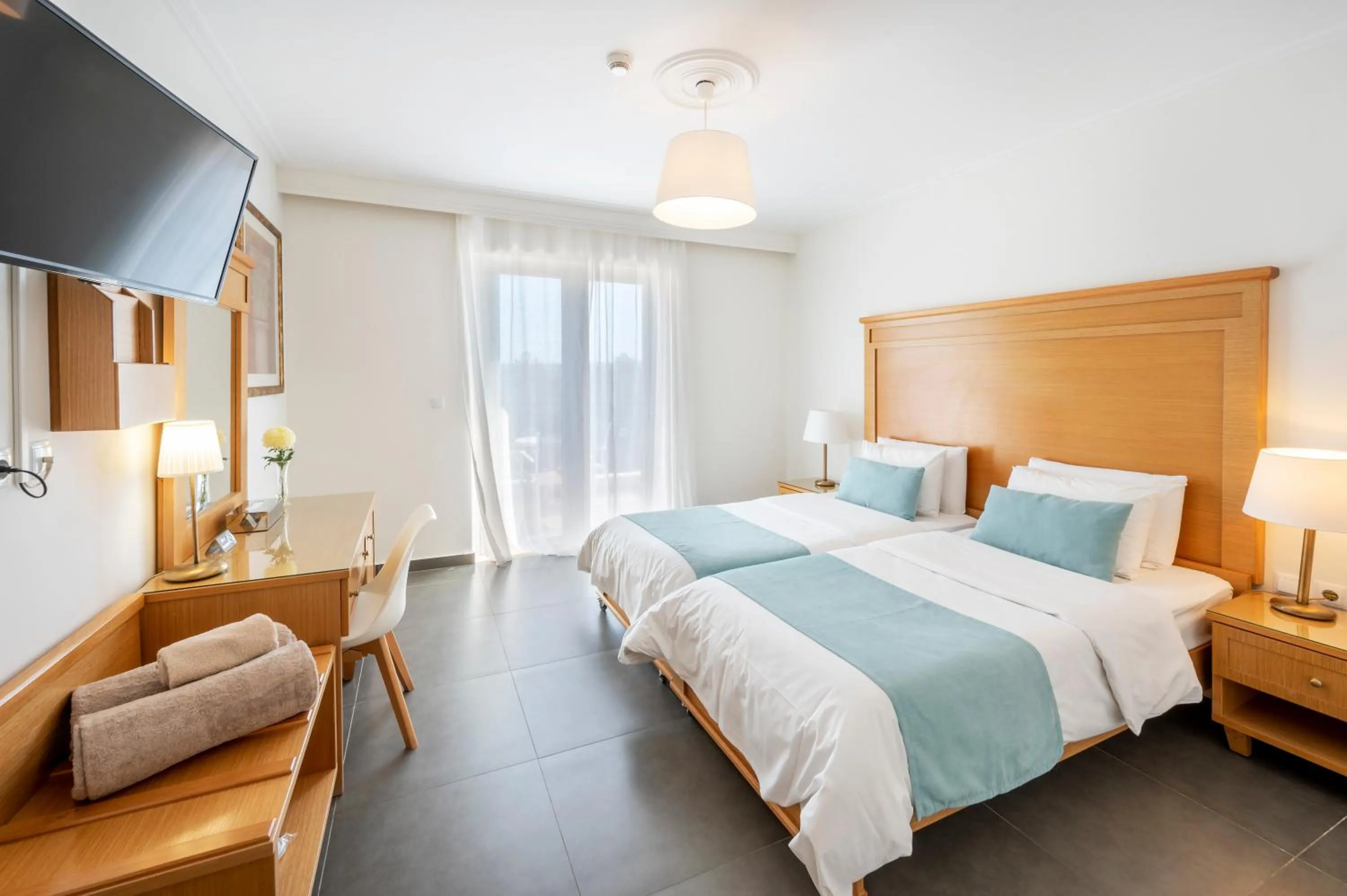 Bed in Peridis Family Resort