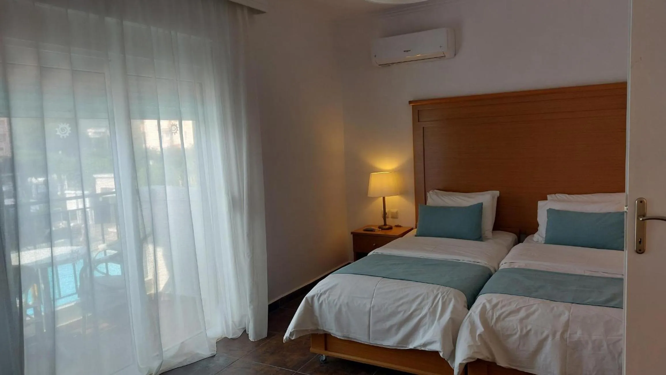 Bed in Peridis Family Resort