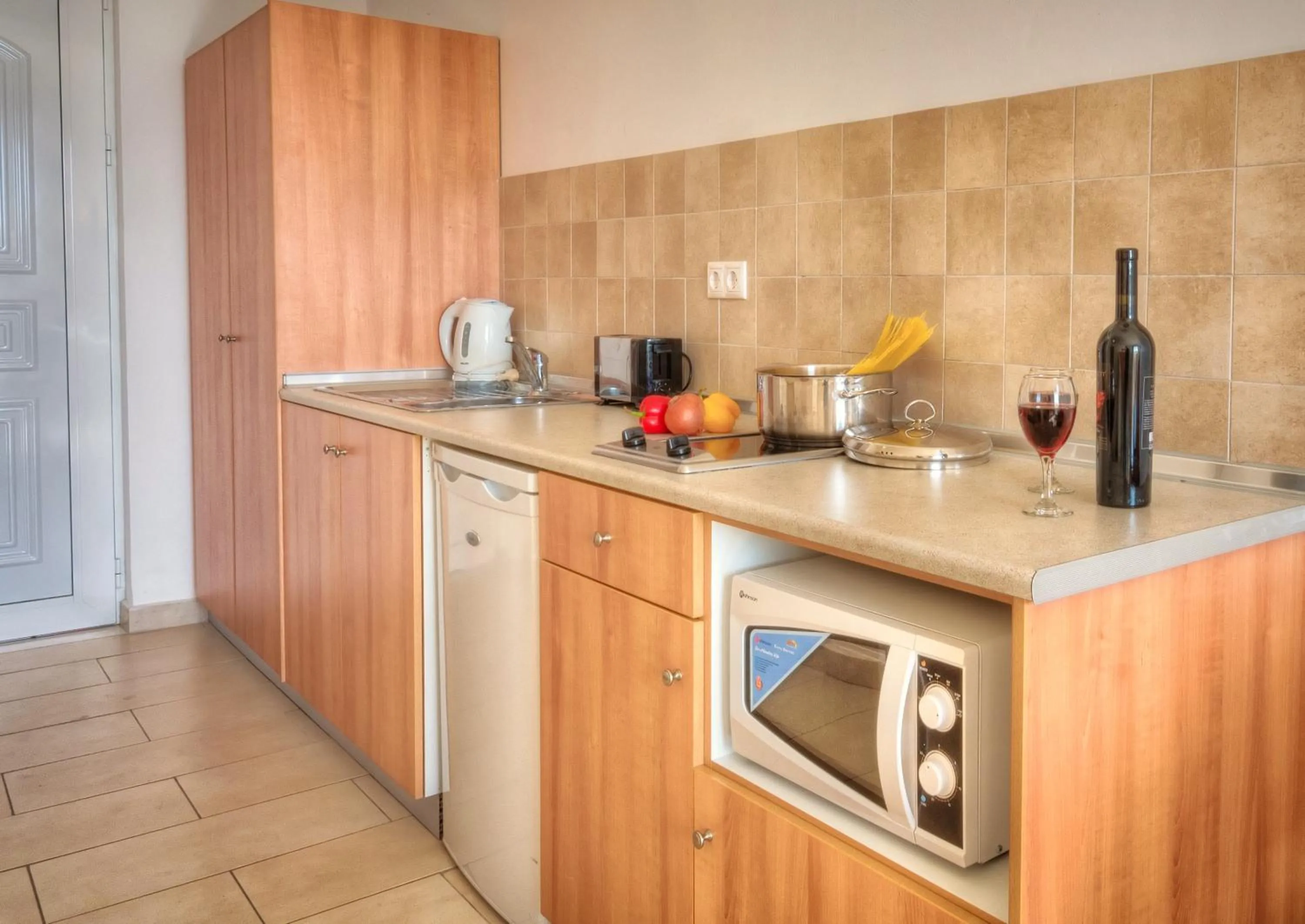 Kitchen or kitchenette in Matina Pefkos Aparthotel