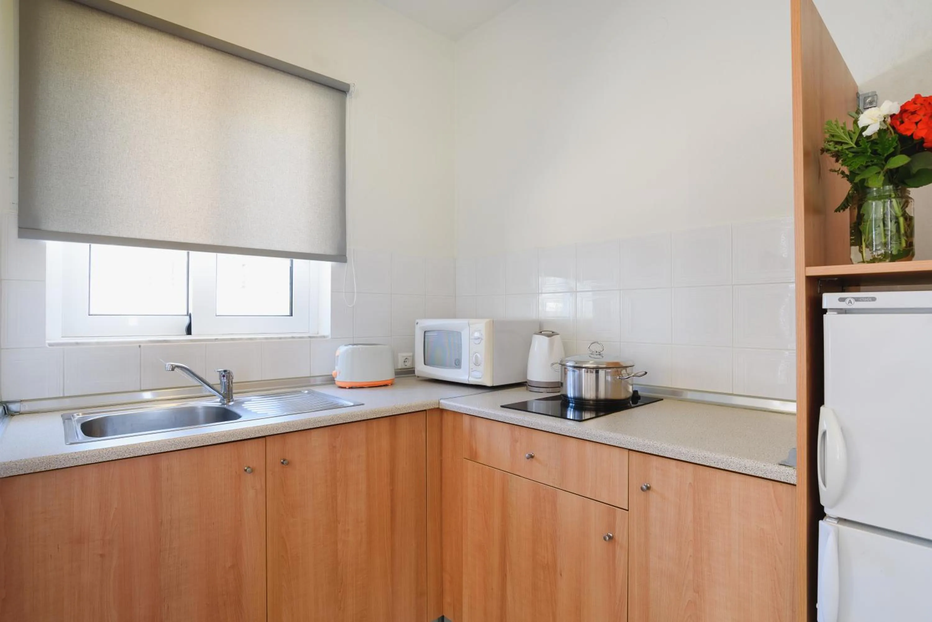 Kitchen or kitchenette in Matina Pefkos Aparthotel